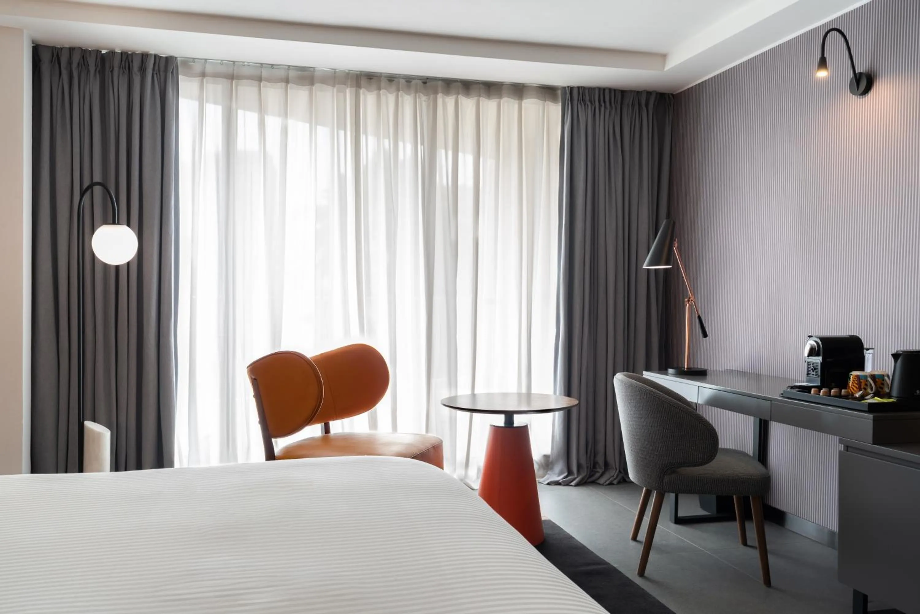 Seating area, Bed in Pullman Kinshasa Grand Hotel