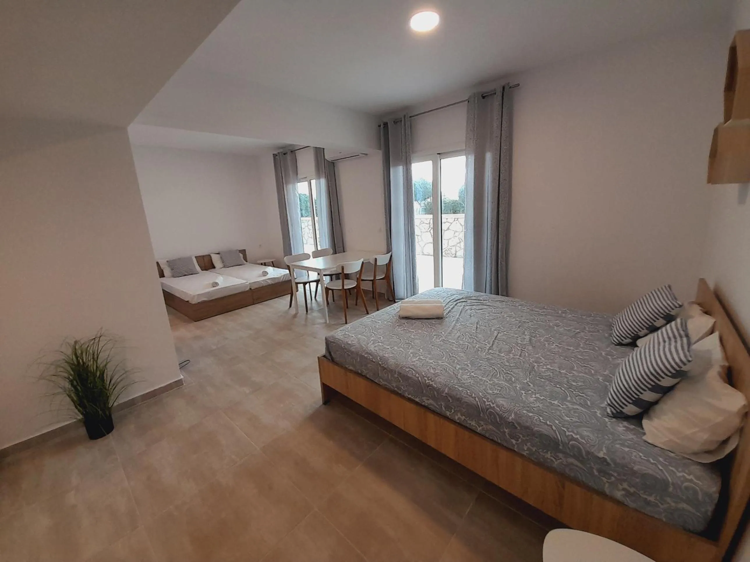 Bed in Telhinis Hotel & Apartments