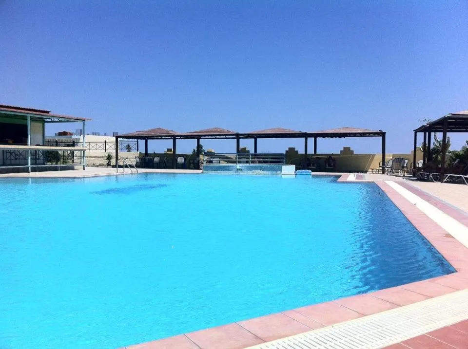 Swimming pool in Telhinis Hotel & Apartments