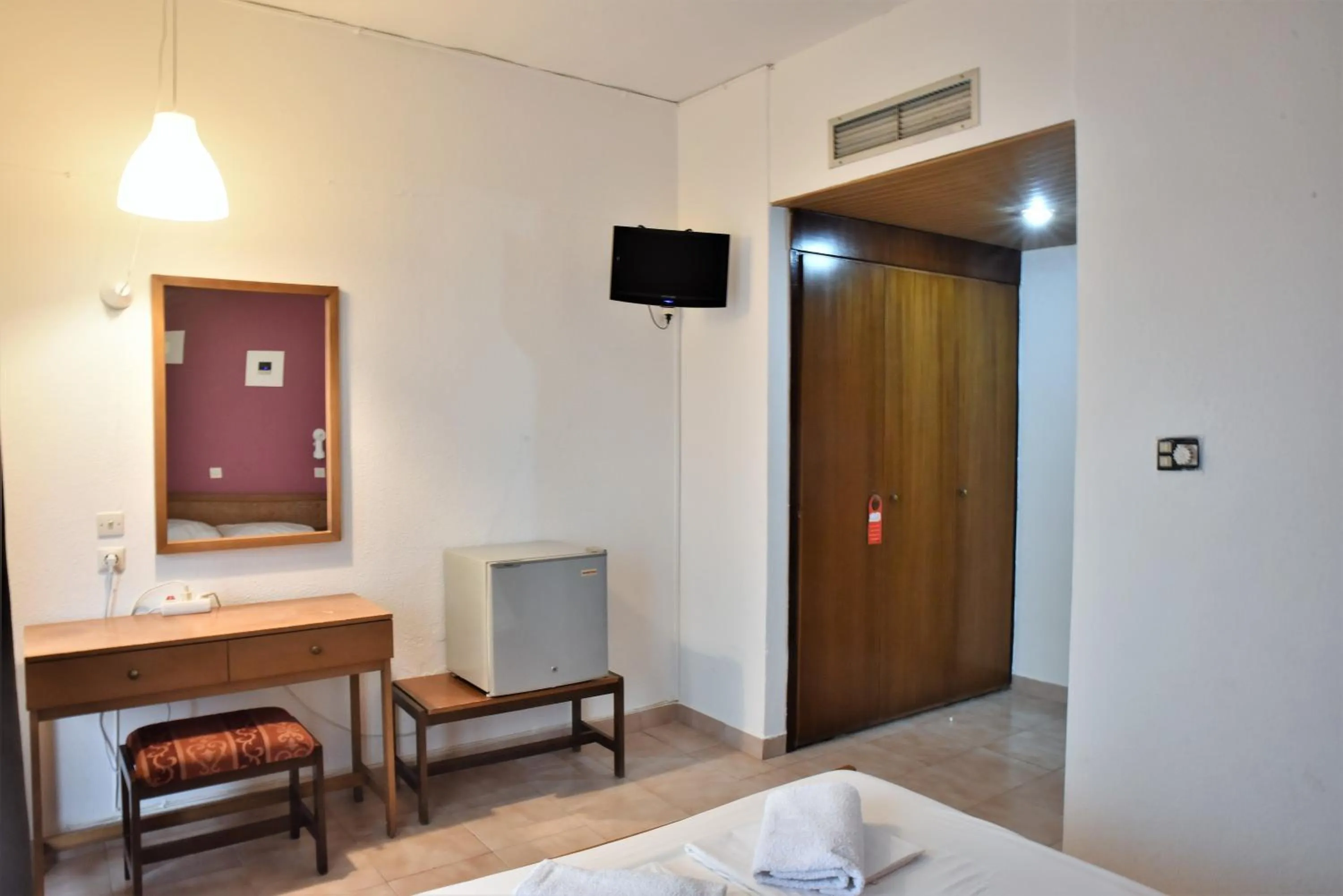 Bed in Telhinis Hotel & Apartments