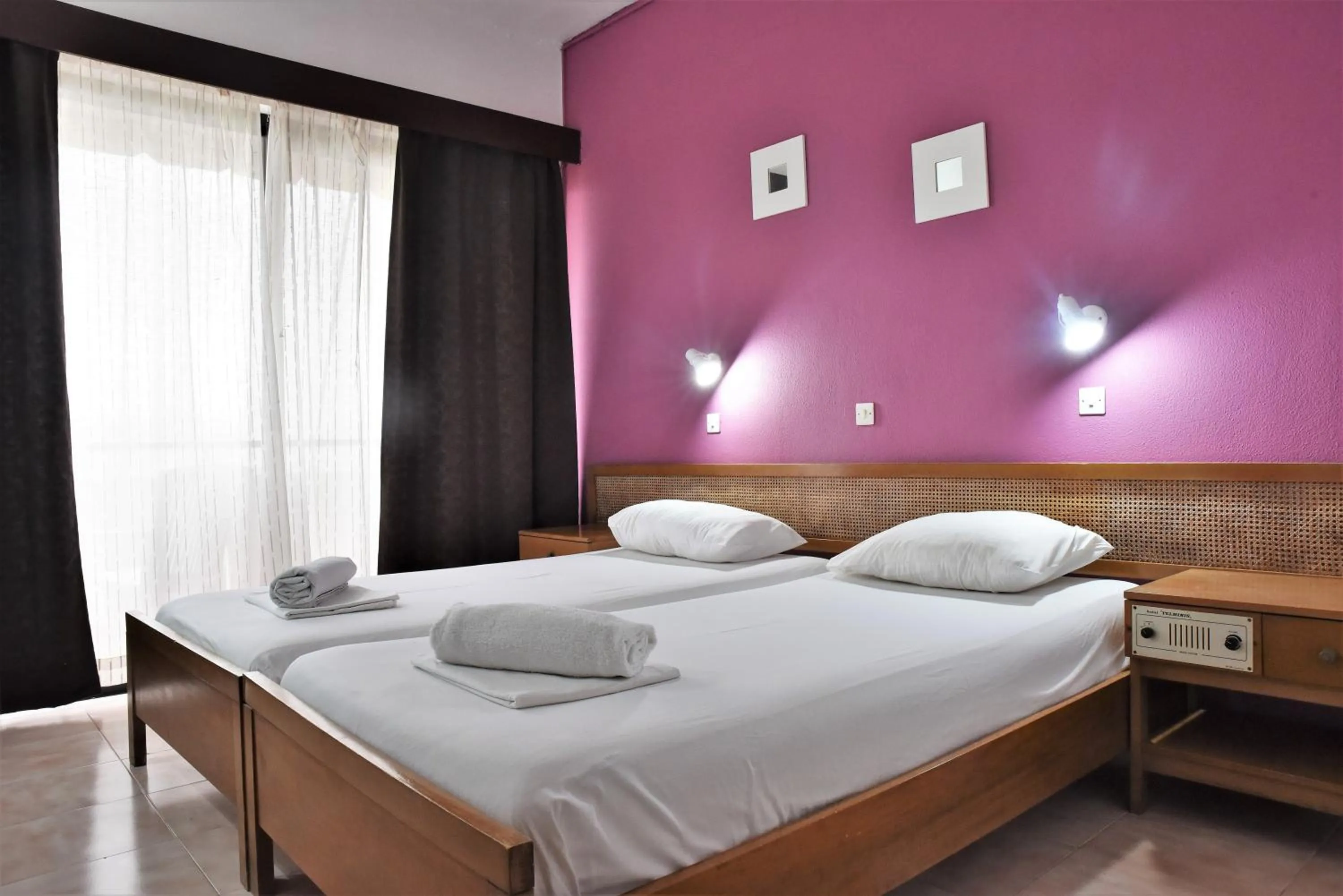Bed in Telhinis Hotel & Apartments