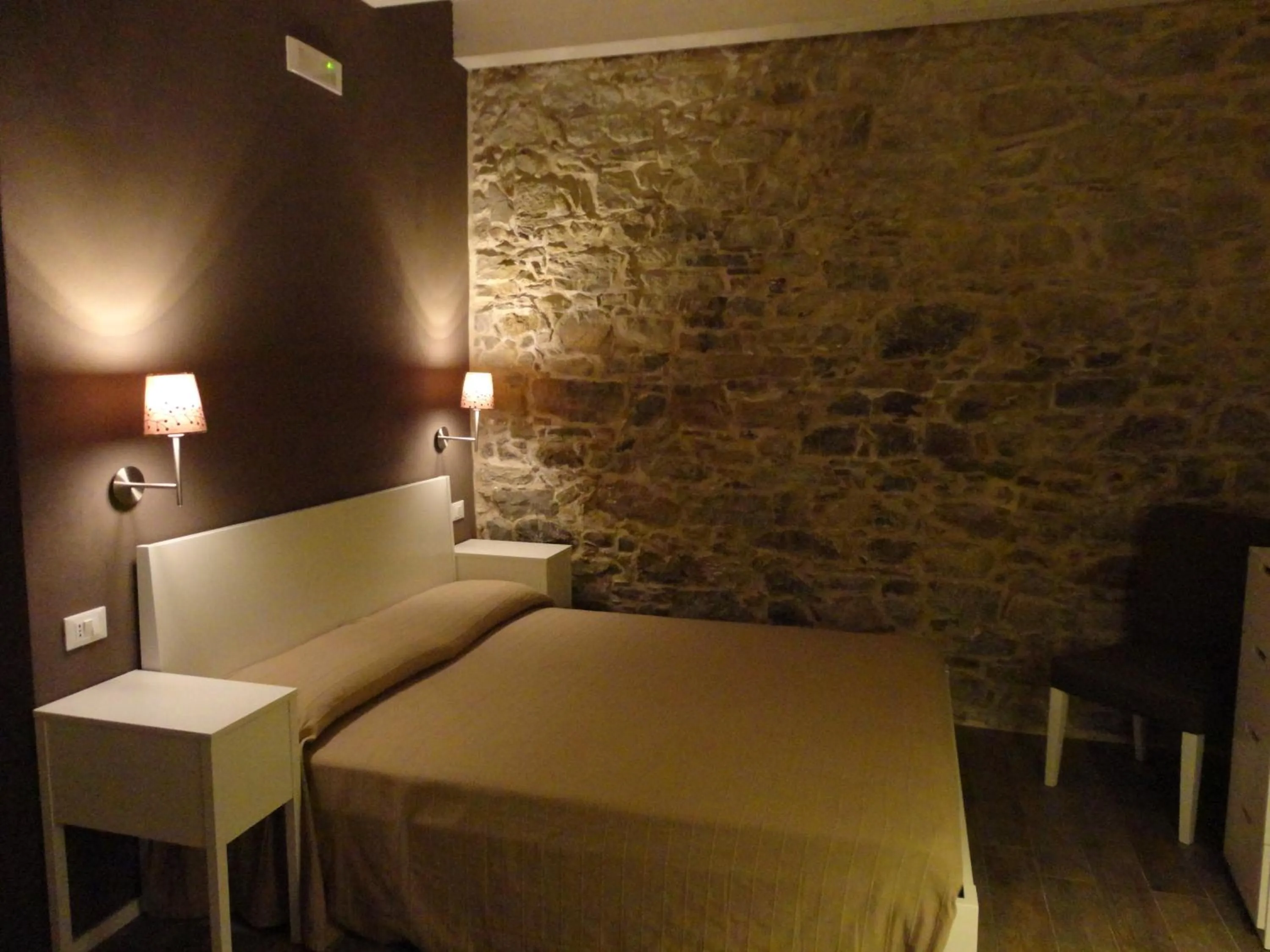 Bedroom in Il Giglio Casa Albergo