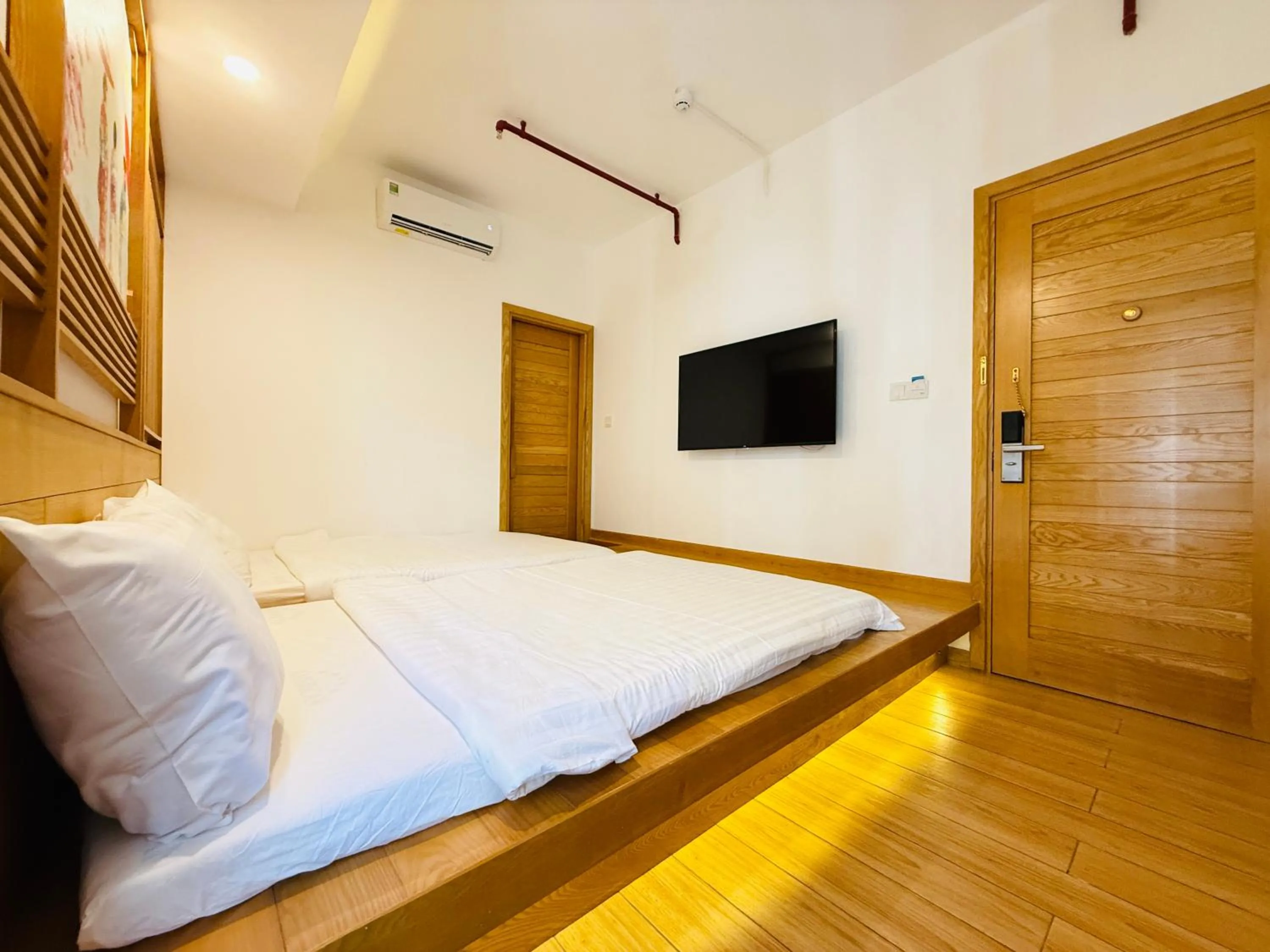 Communal lounge/ TV room, Bed in Fuji Boutique Hotel Nha Trang
