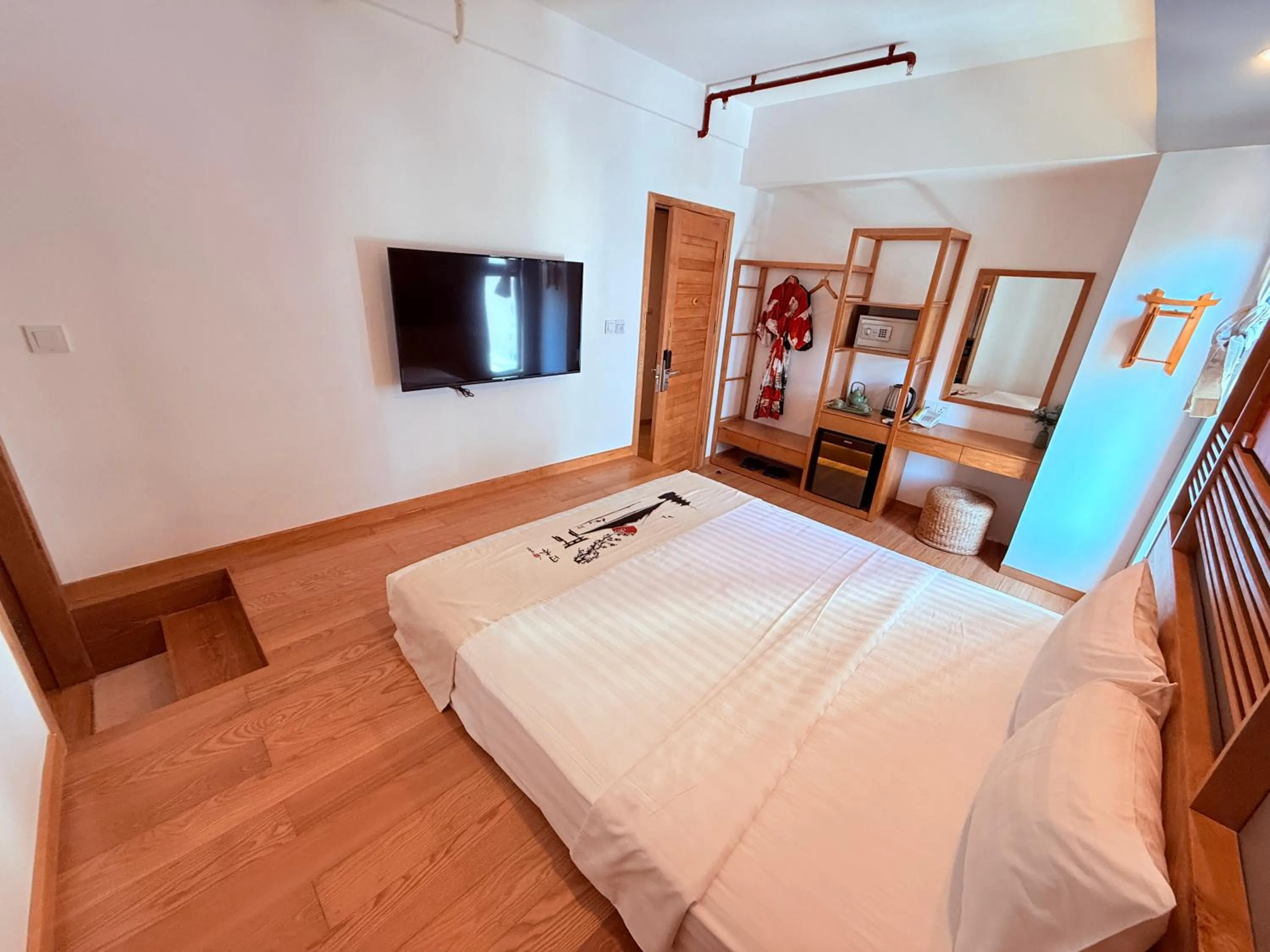 Communal lounge/ TV room, Bed in Fuji Boutique Hotel Nha Trang