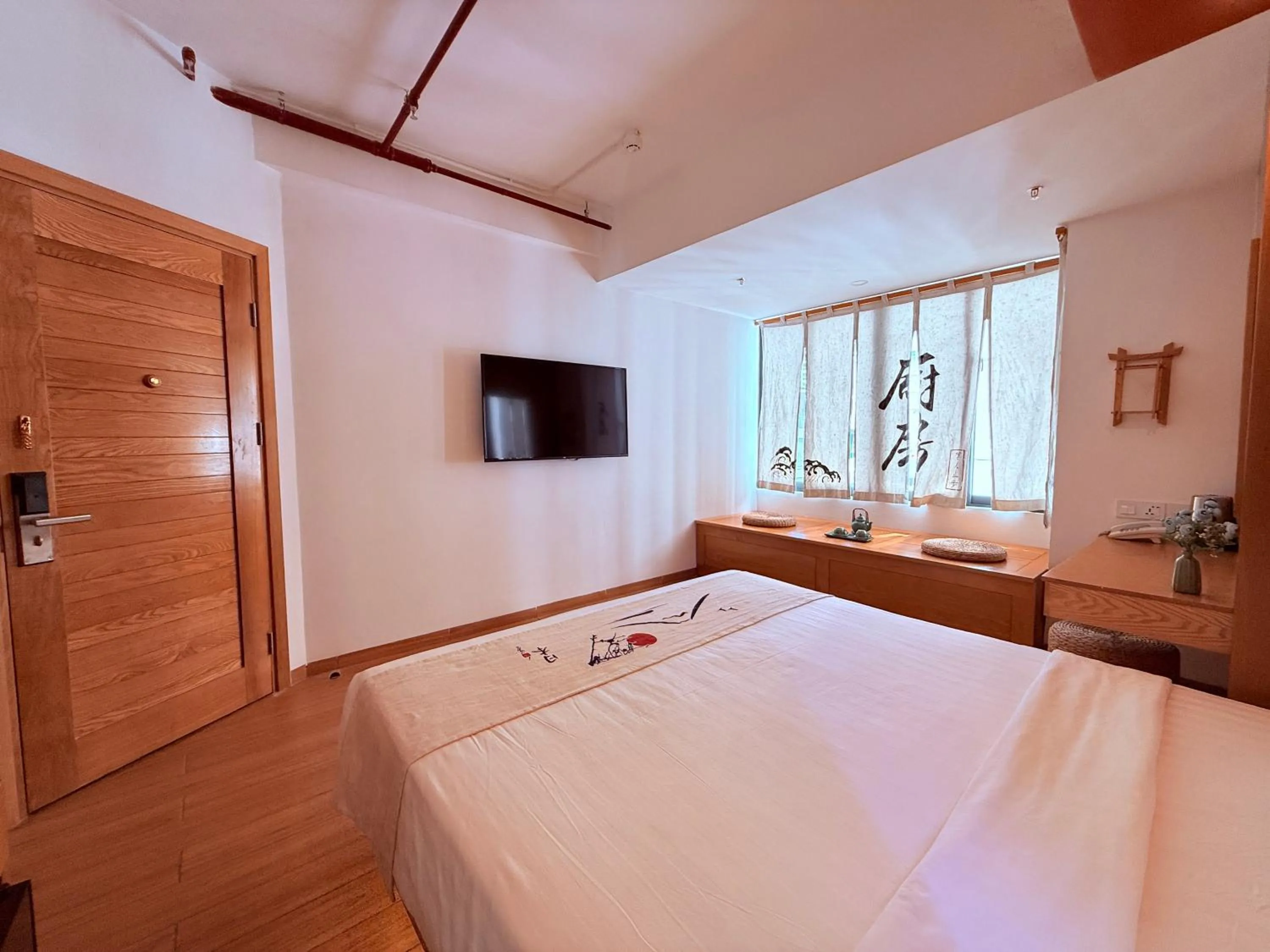 Communal lounge/ TV room, Bed in Fuji Boutique Hotel Nha Trang