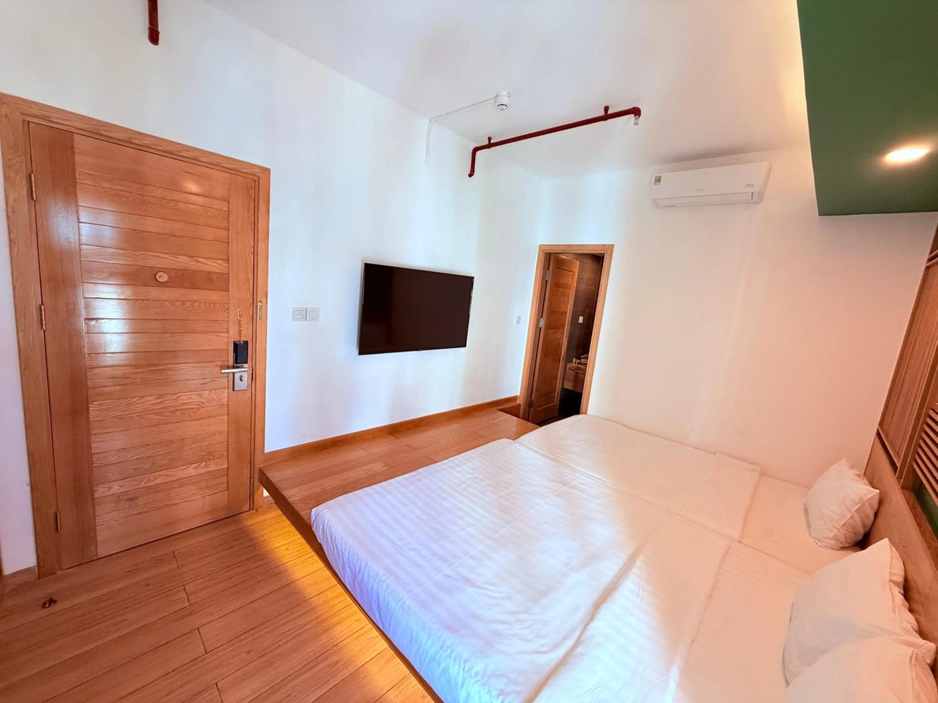 Communal lounge/ TV room, Bed in Fuji Boutique Hotel Nha Trang