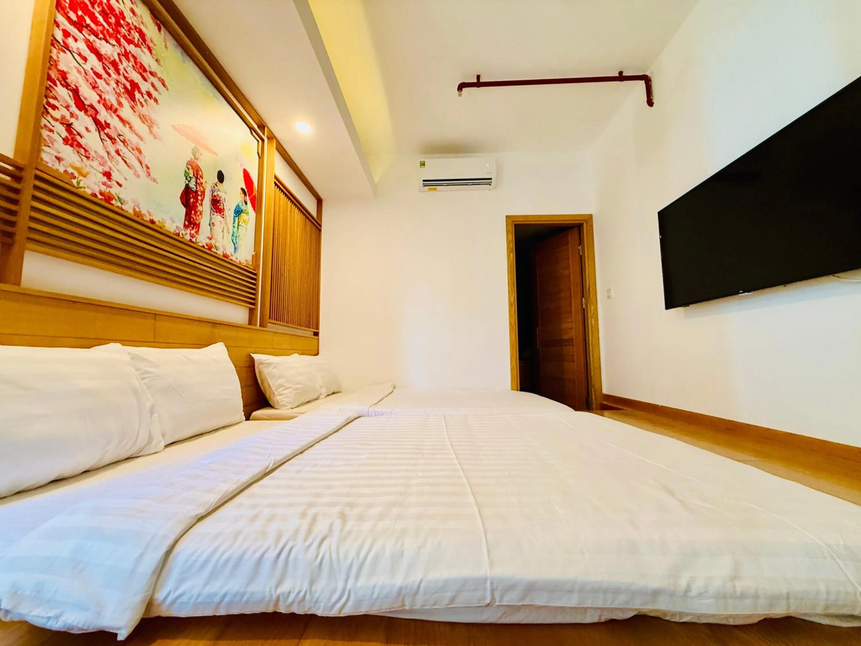Communal lounge/ TV room, Bed in Fuji Boutique Hotel Nha Trang