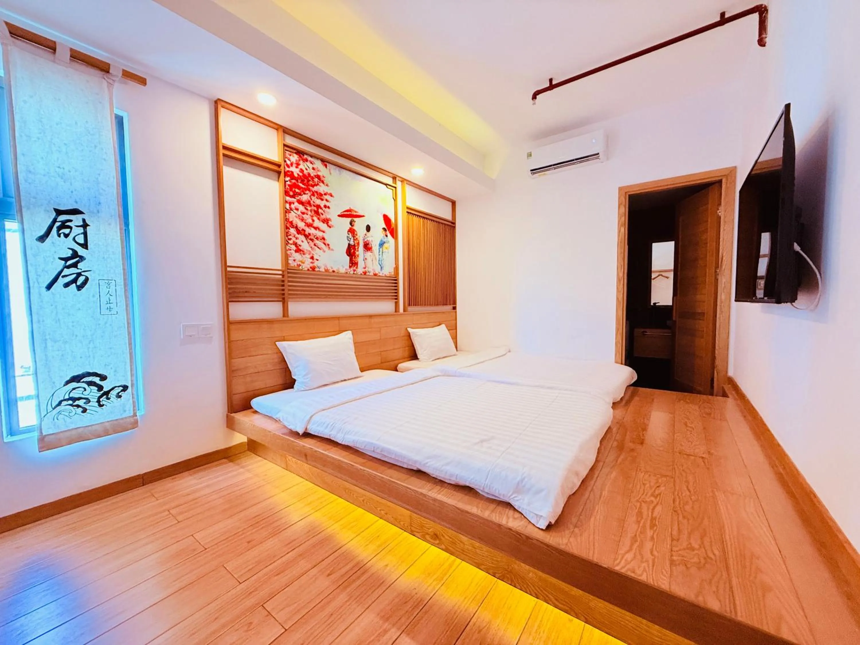 Communal lounge/ TV room, Bed in Fuji Boutique Hotel Nha Trang