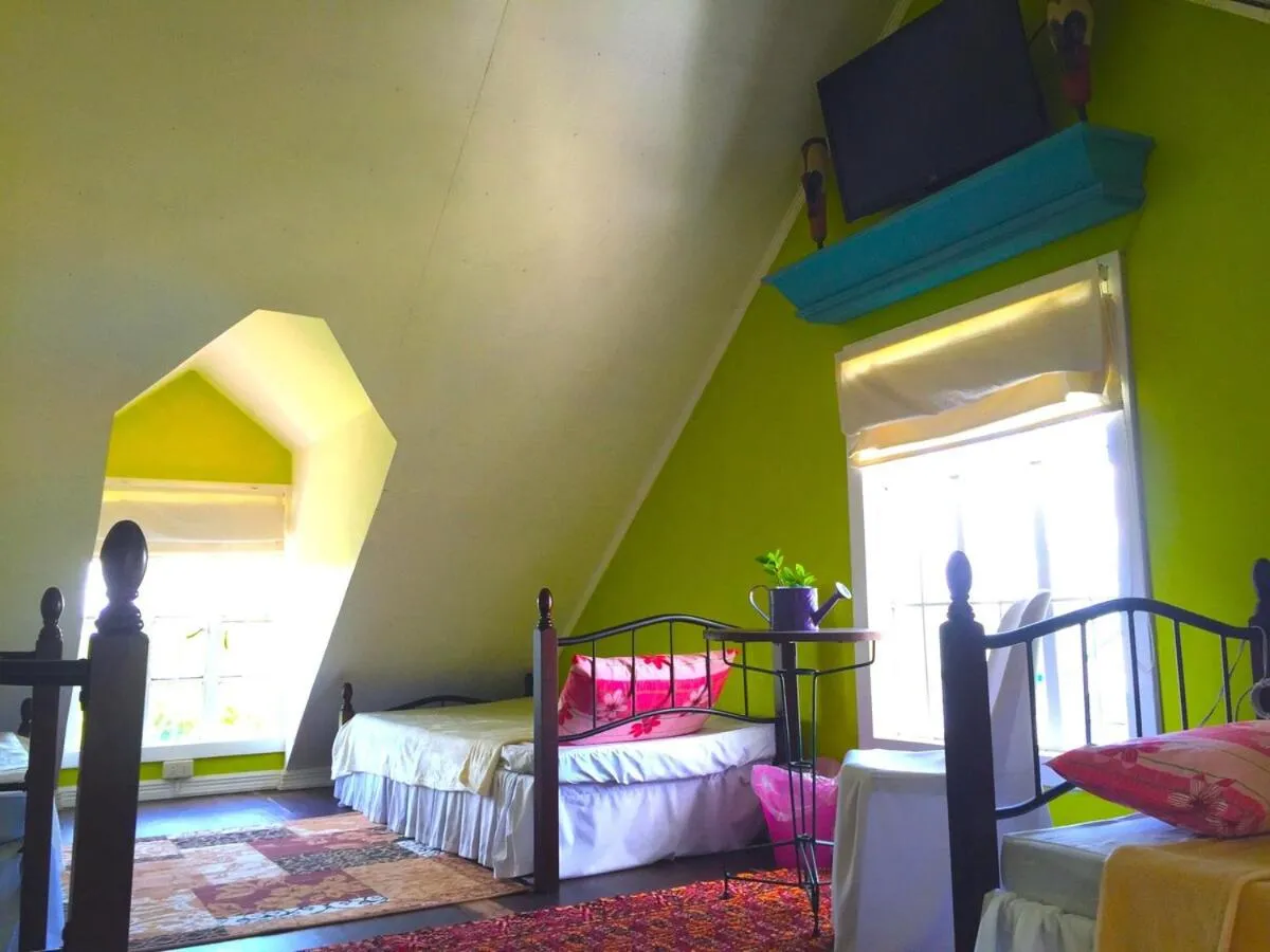 Bed in Madie's Place B&B with Private Pool in Santa Rosa near Enchanted Kingdom