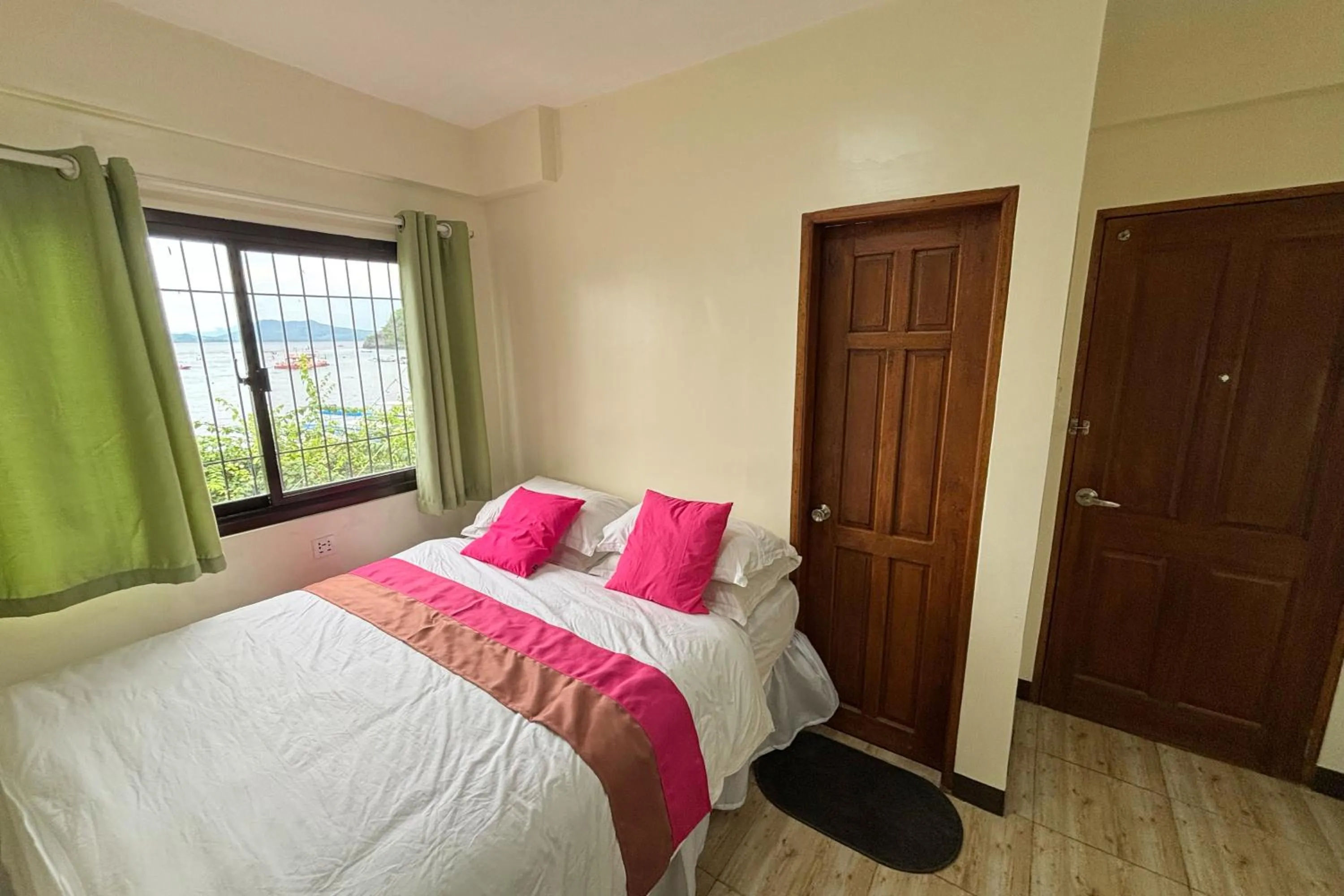 Bed in Pink Ocean Diving Resort Sabang Puerto Galera