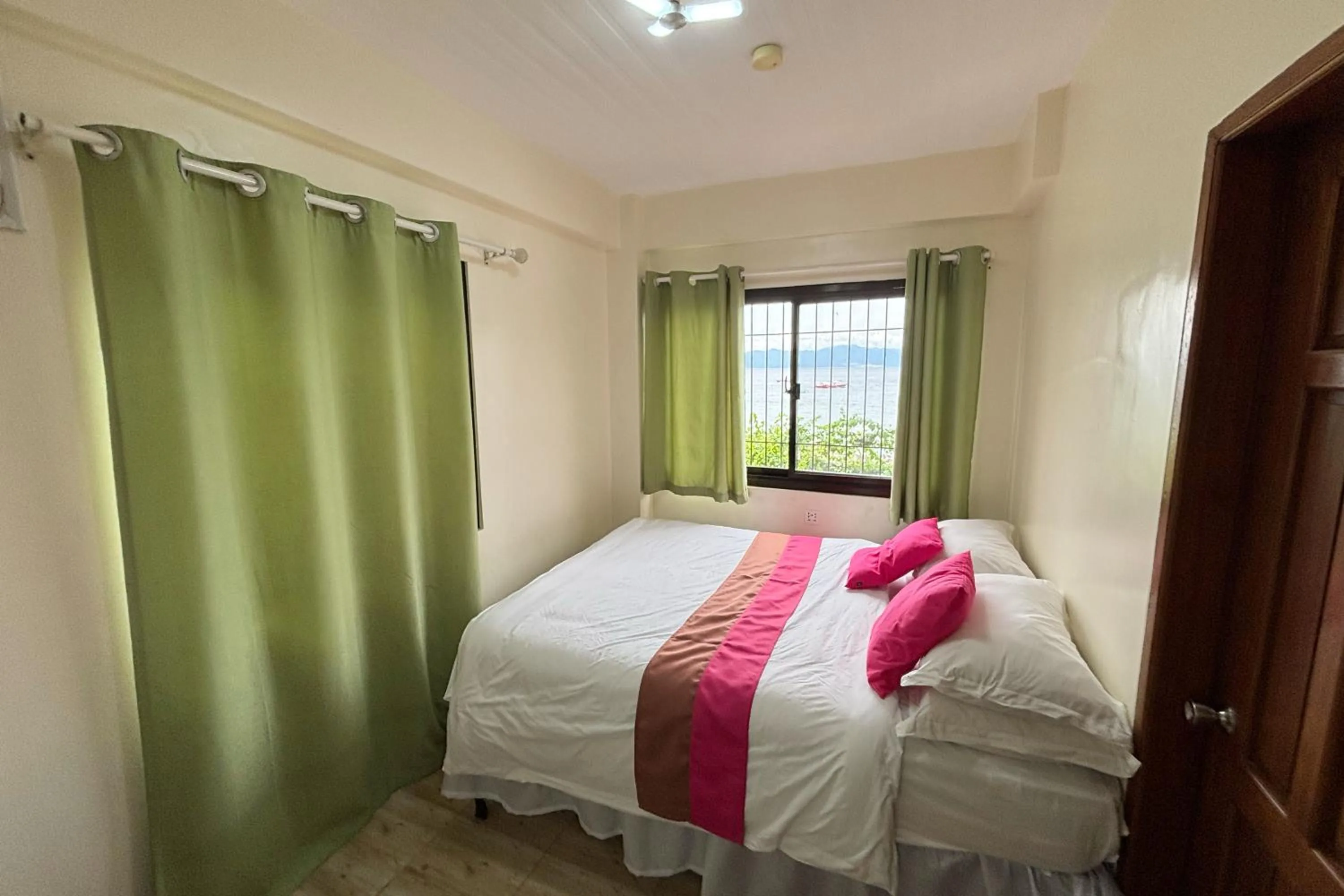 Bed in Pink Ocean Diving Resort Sabang Puerto Galera