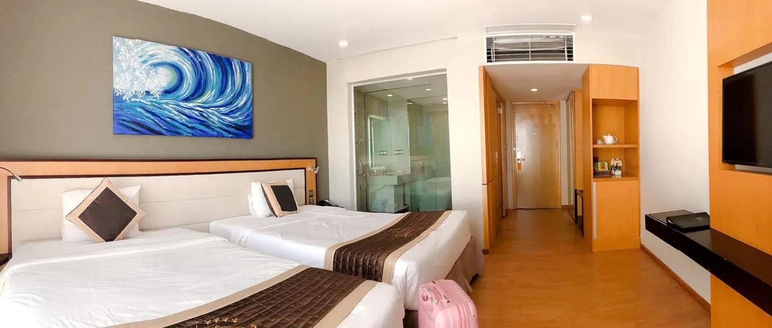 Bed in Dragon Sea Hotel