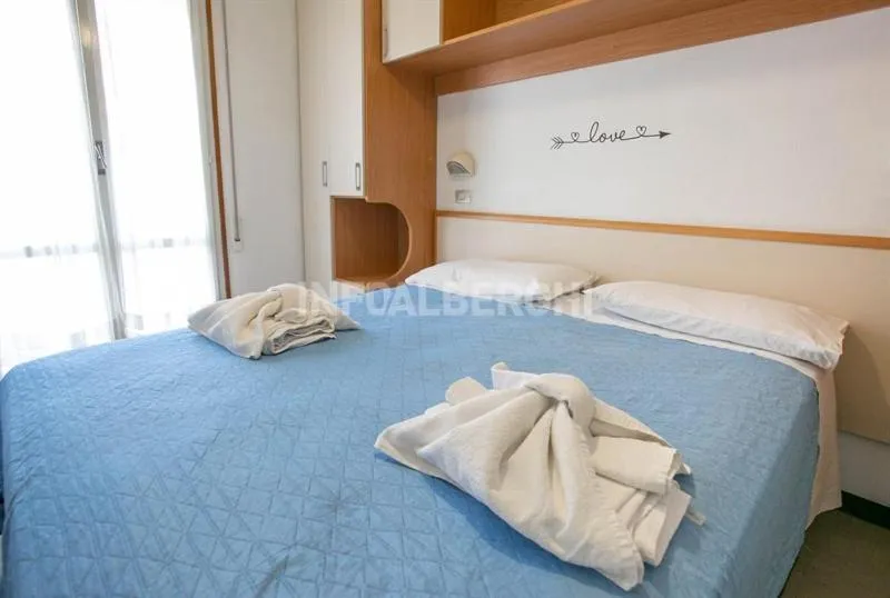 Bed in Hotel Paradiso