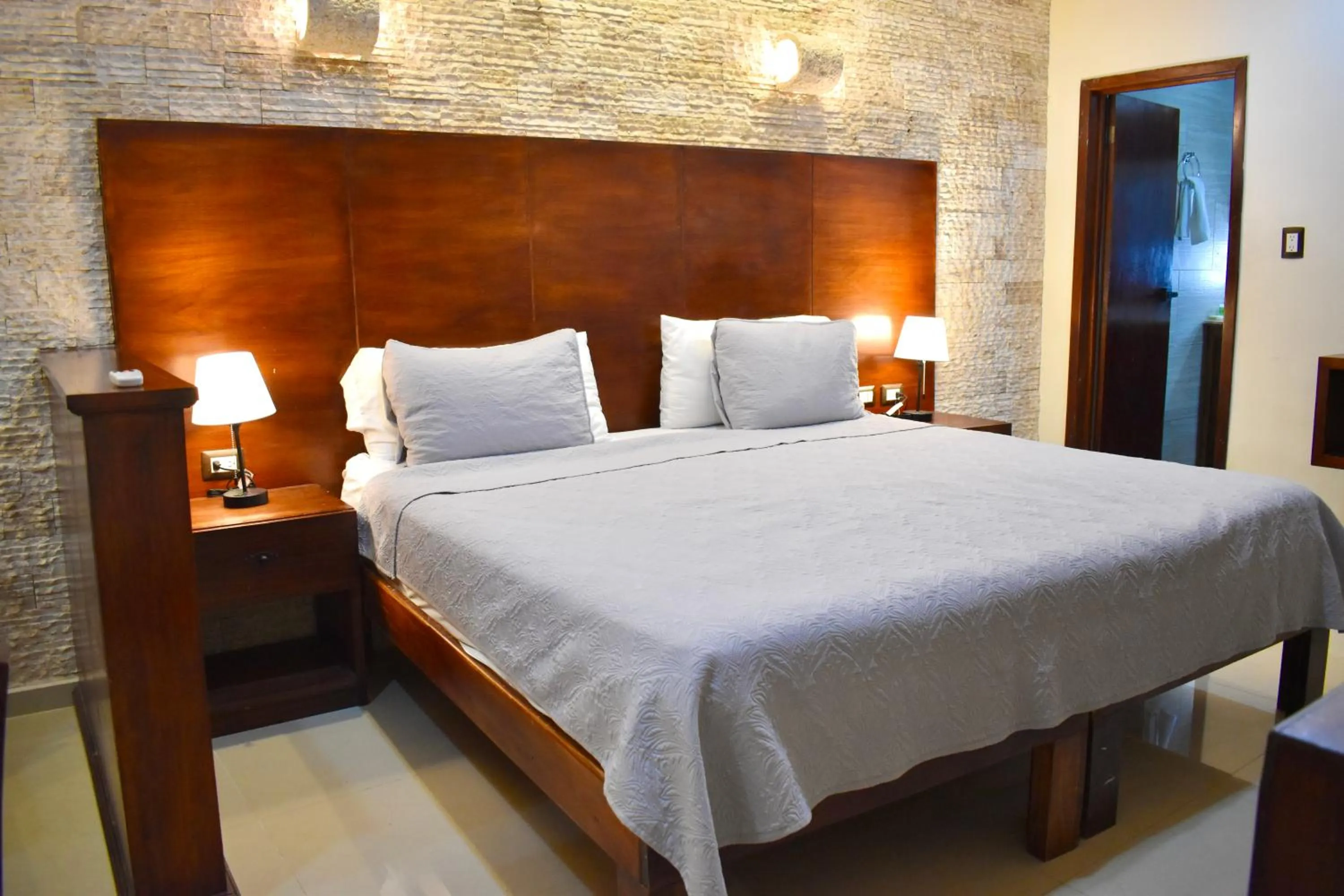 Bed in El Zaguán Colonial by GuruHotel