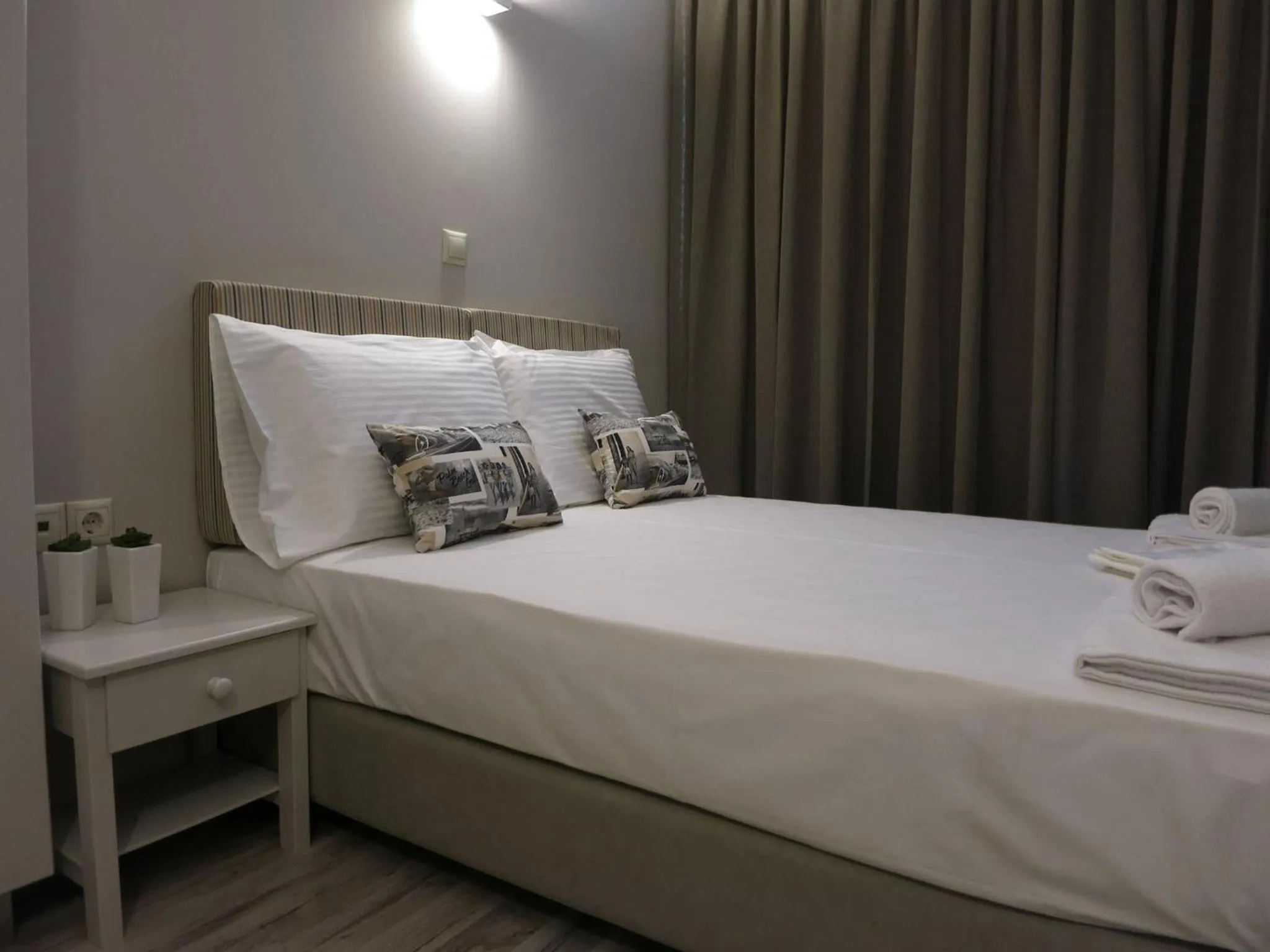 Bed in Pantheon Aparthotel