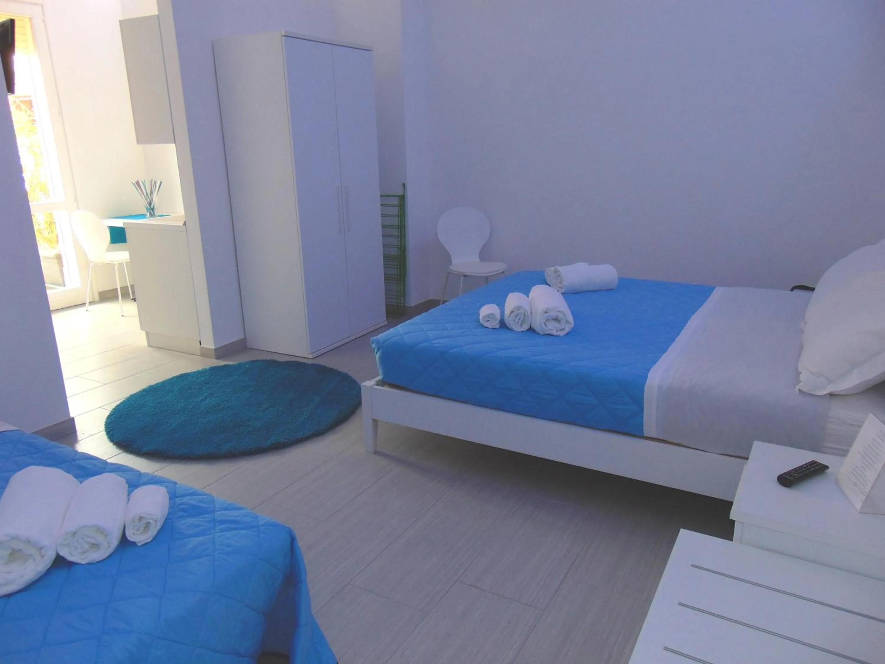 Photo of the whole room, Bed in Residence Le Isole