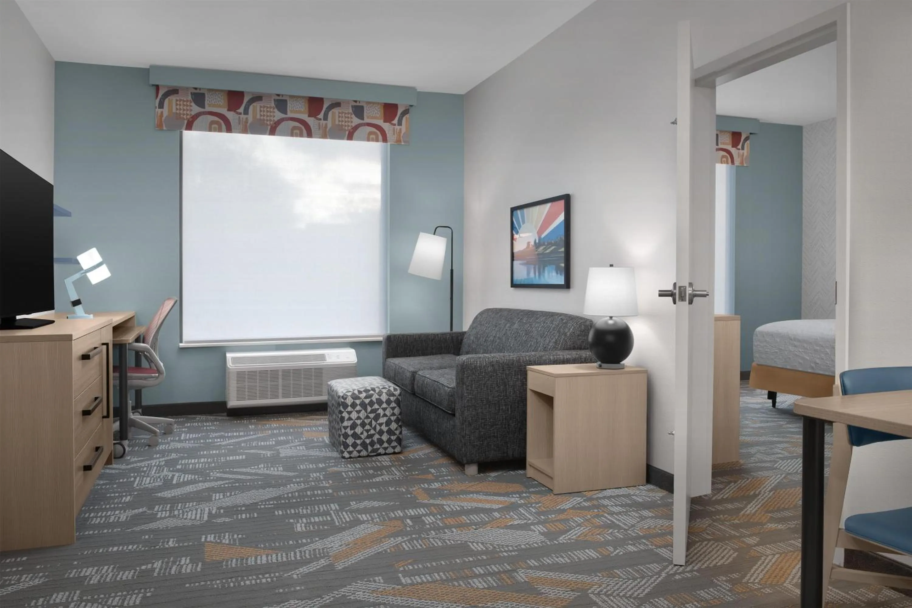 Living room in Home2 Suites By Hilton Syracuse Liverpool Airport Area