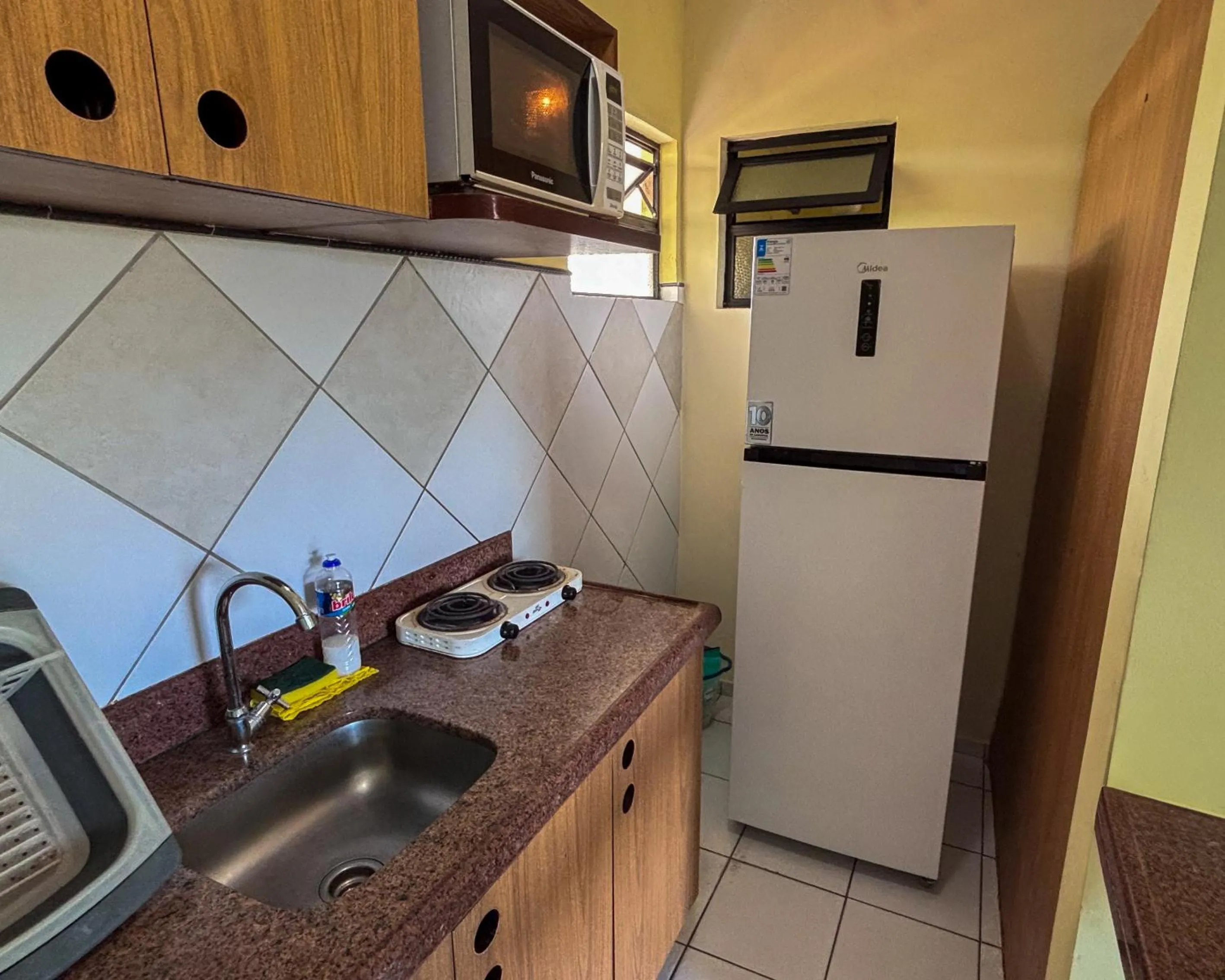Kitchen or kitchenette in Vilamar Suítes