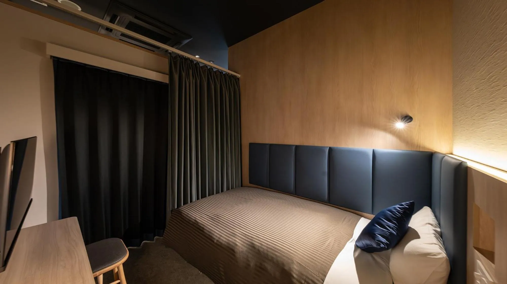 Photo of the whole room, Bed in Quintessa Hotel Fukuoka watanabedori Comic&Books