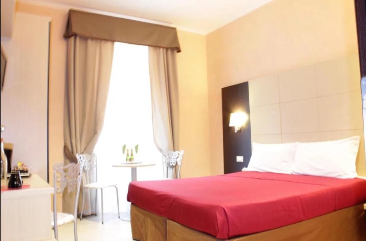 Bed in Candia Inn Vatican