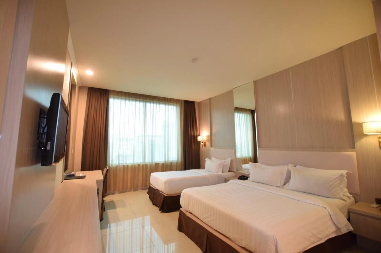 Bed in Grand Paragon Hotel