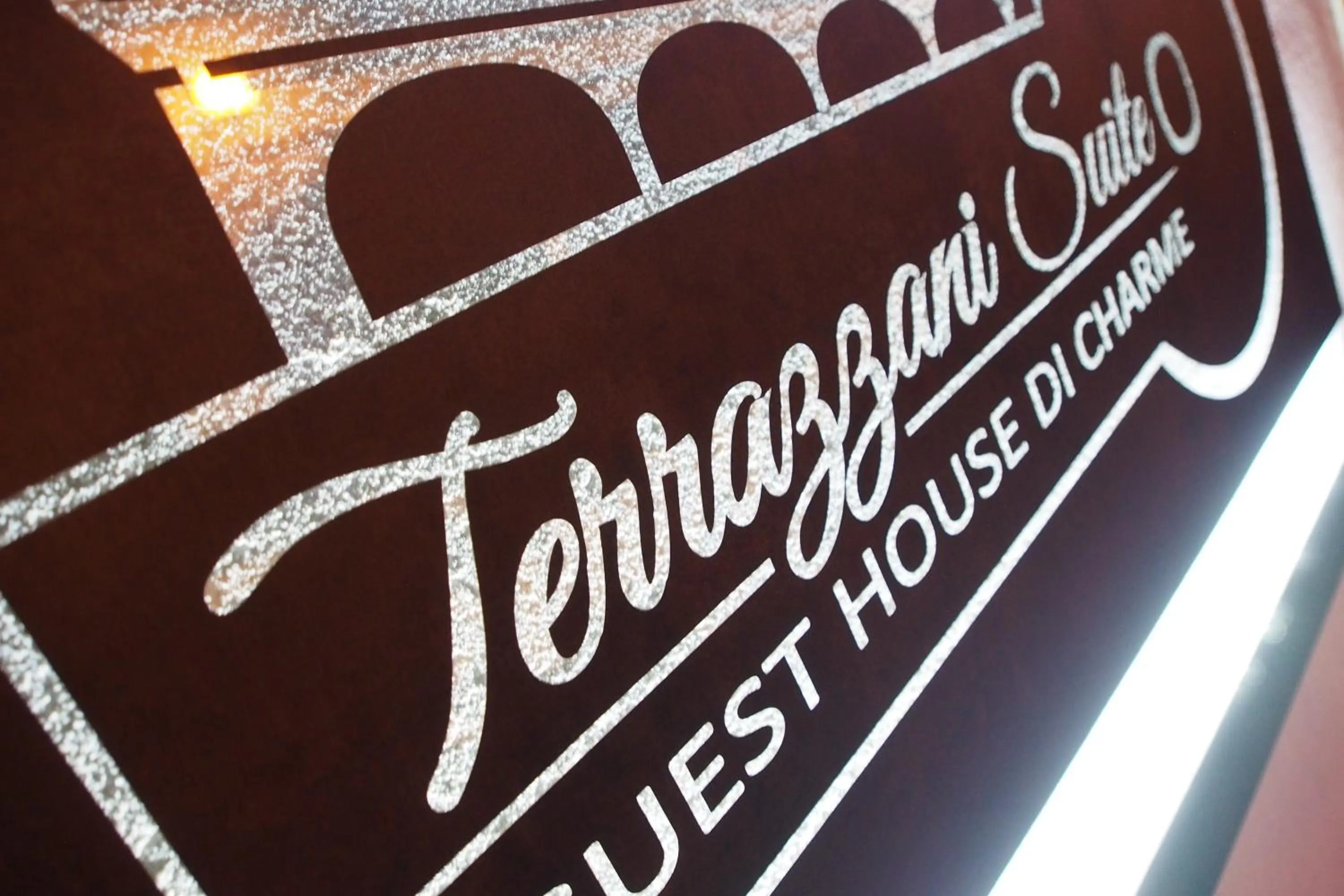 Property logo or sign in Terrazzani Suite
