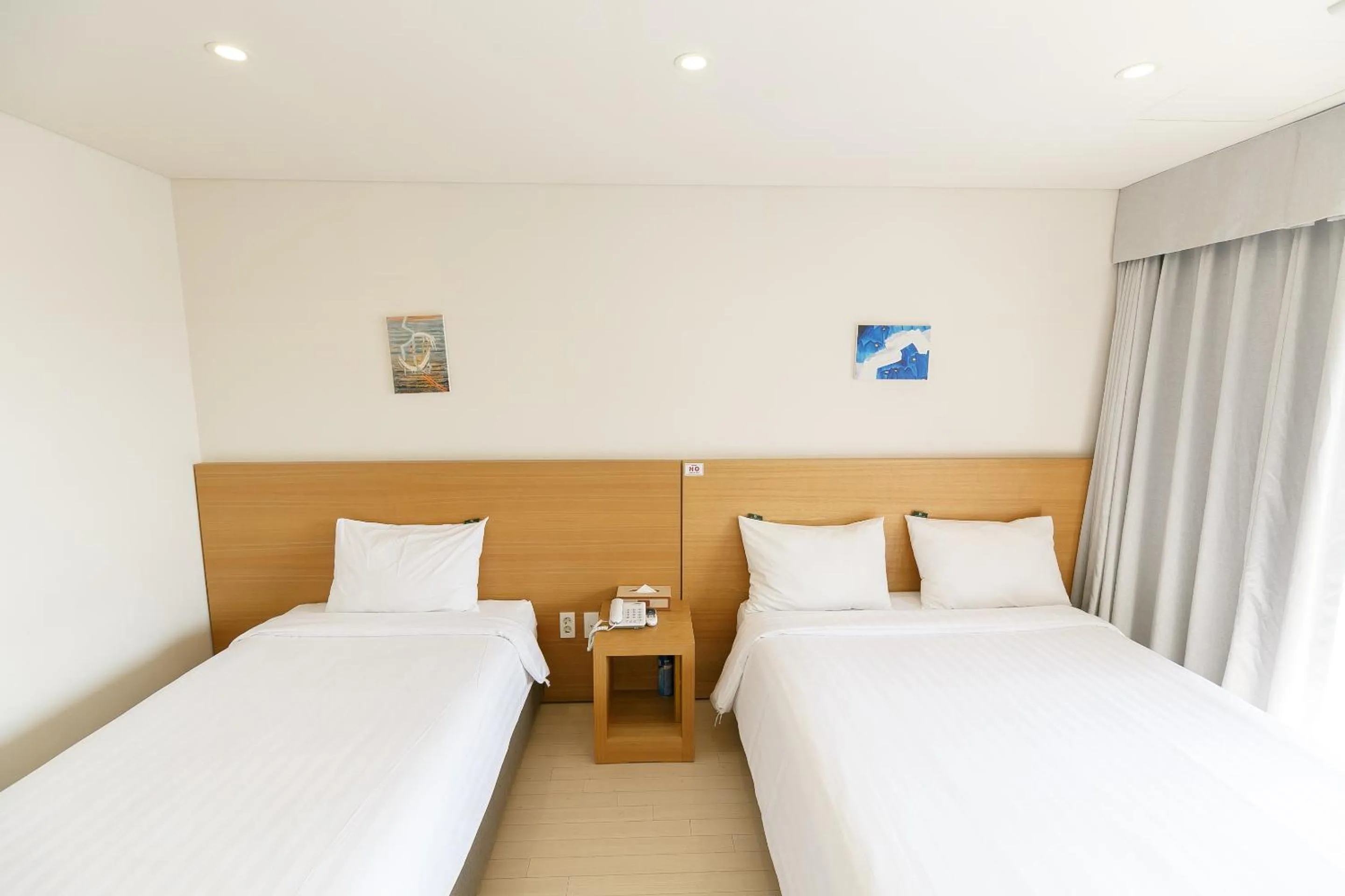 Bed in BK Hotel Jeju