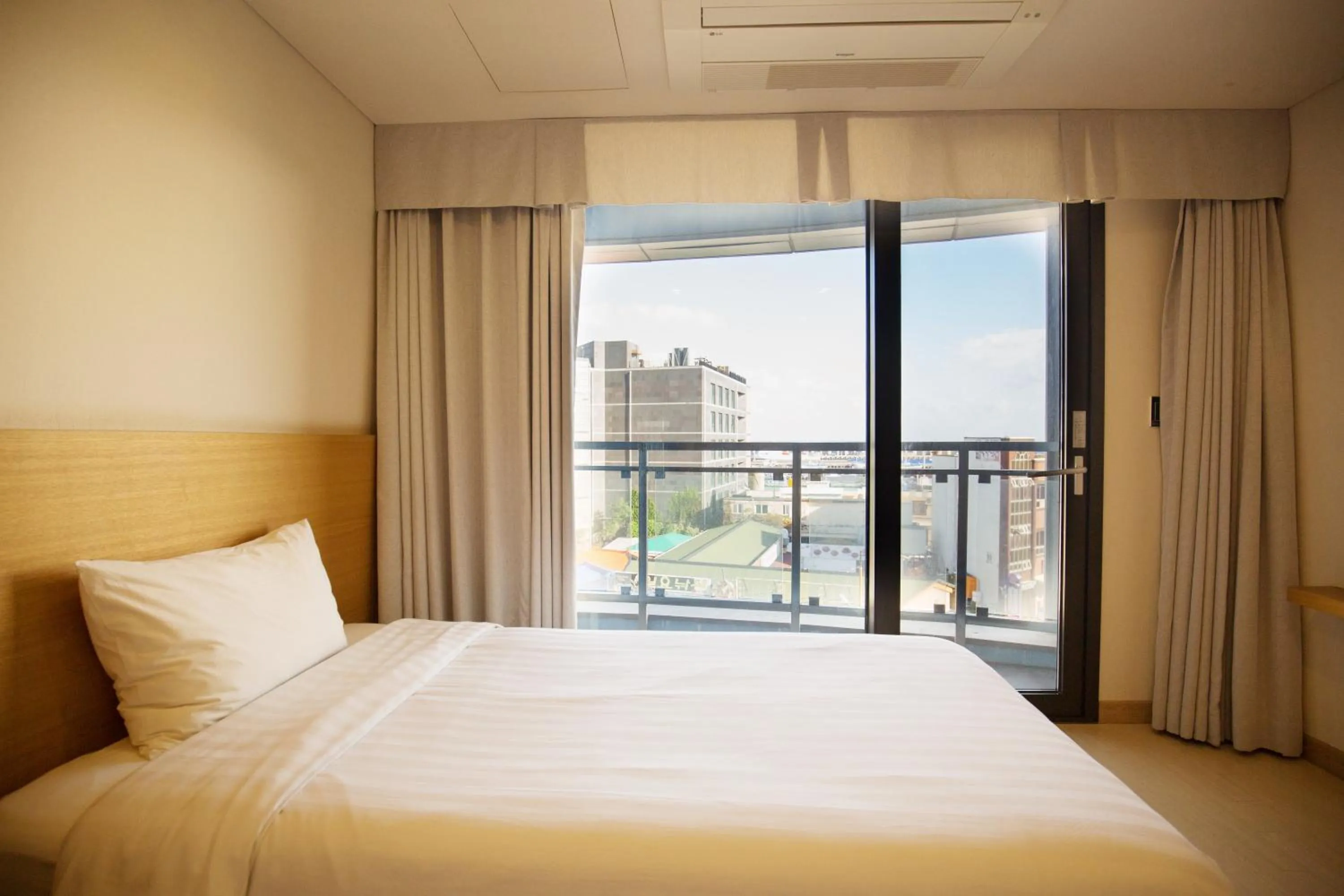 Bed in BK Hotel Jeju