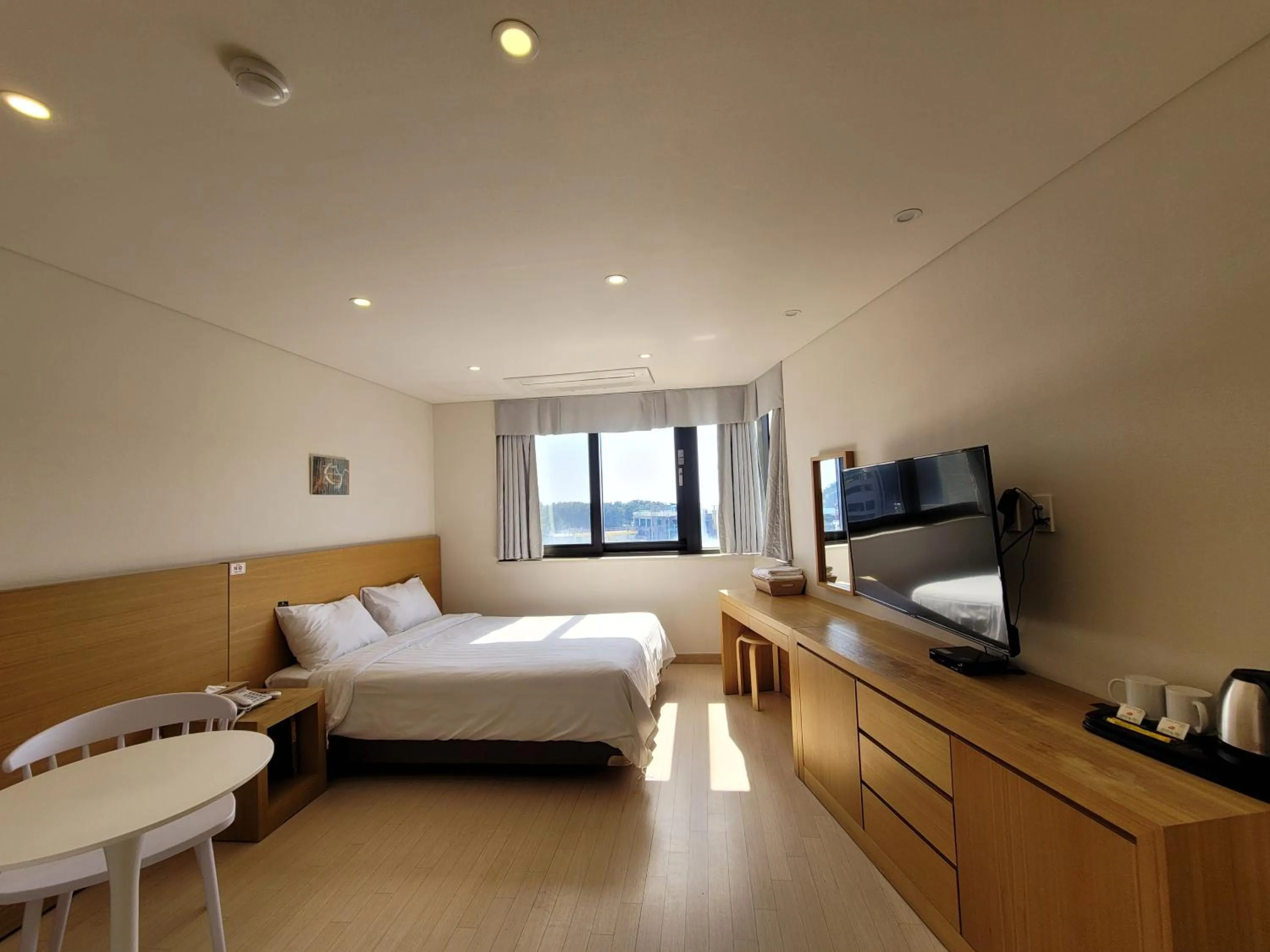 Photo of the whole room, Bed in BK Hotel Jeju