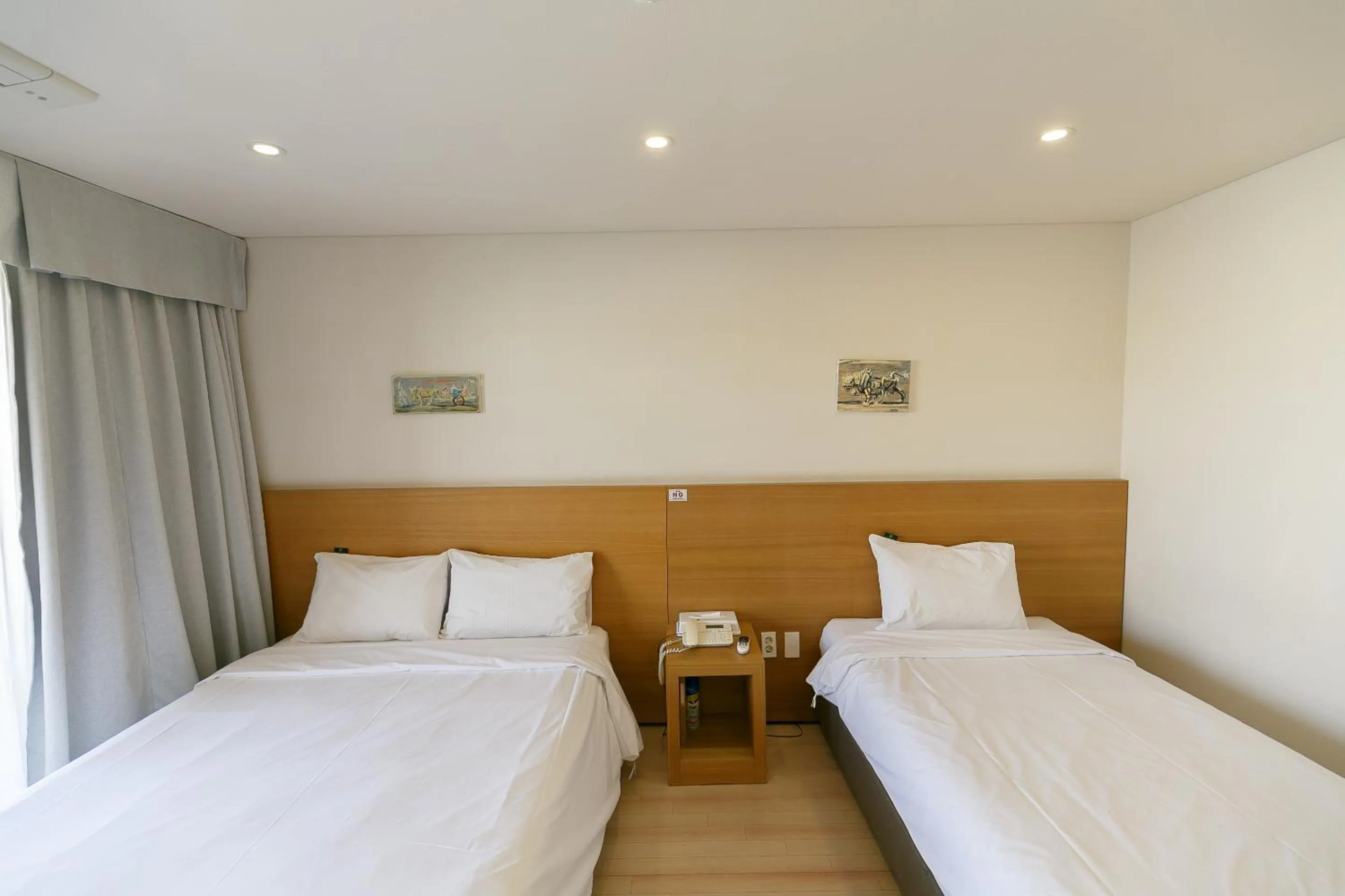 Bed in BK Hotel Jeju