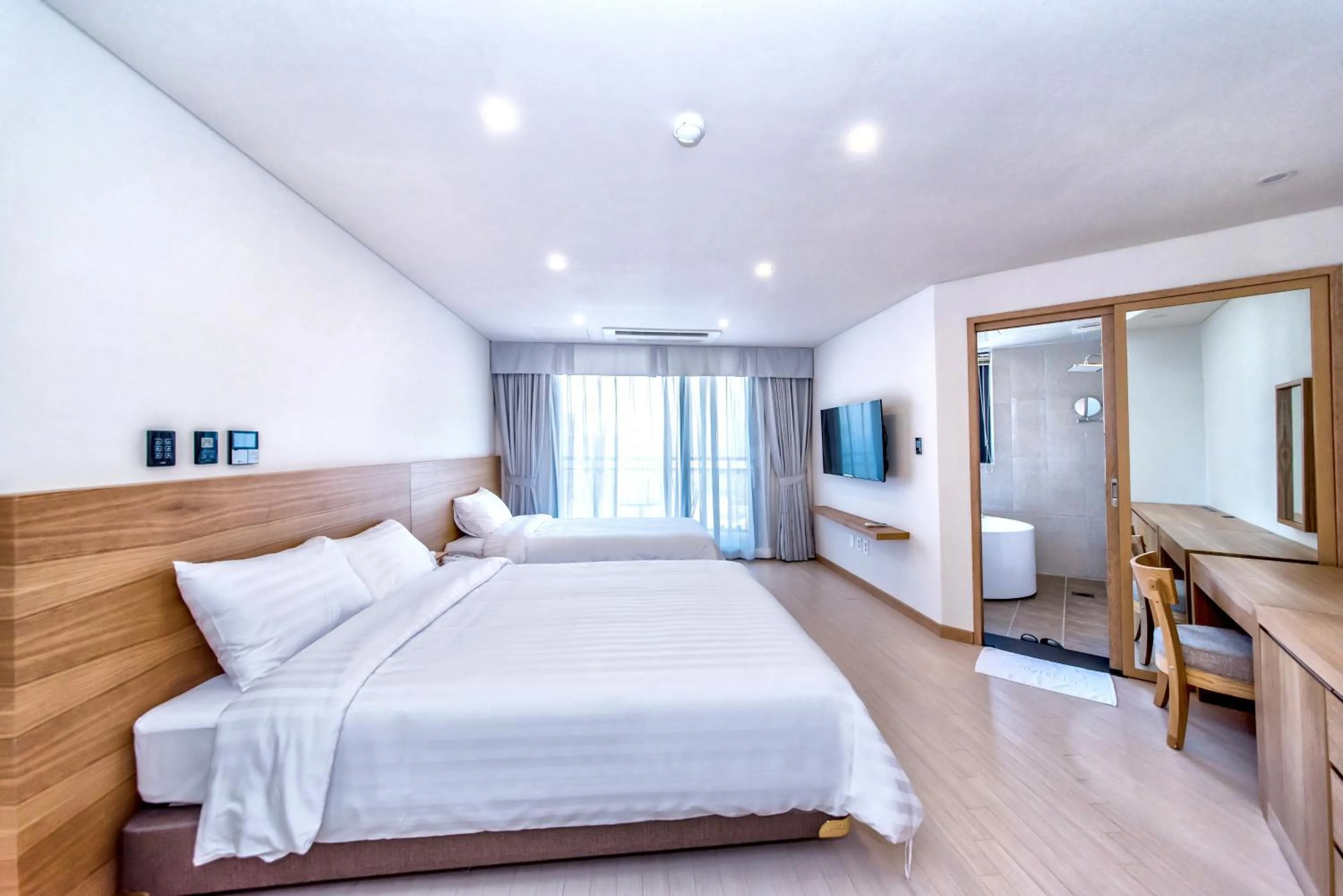 Photo of the whole room, Bed in BK Hotel Jeju