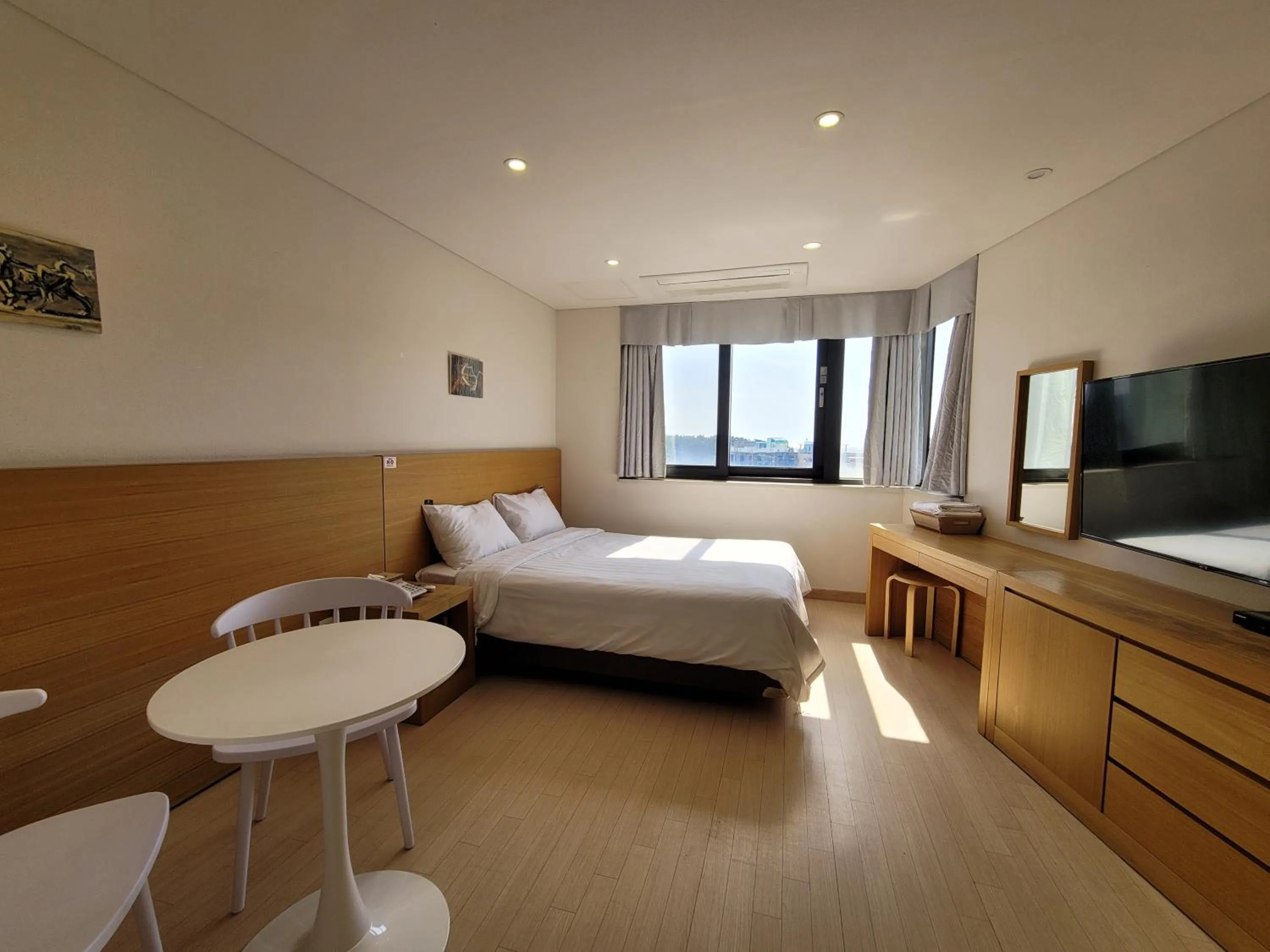 Photo of the whole room, Bed in BK Hotel Jeju