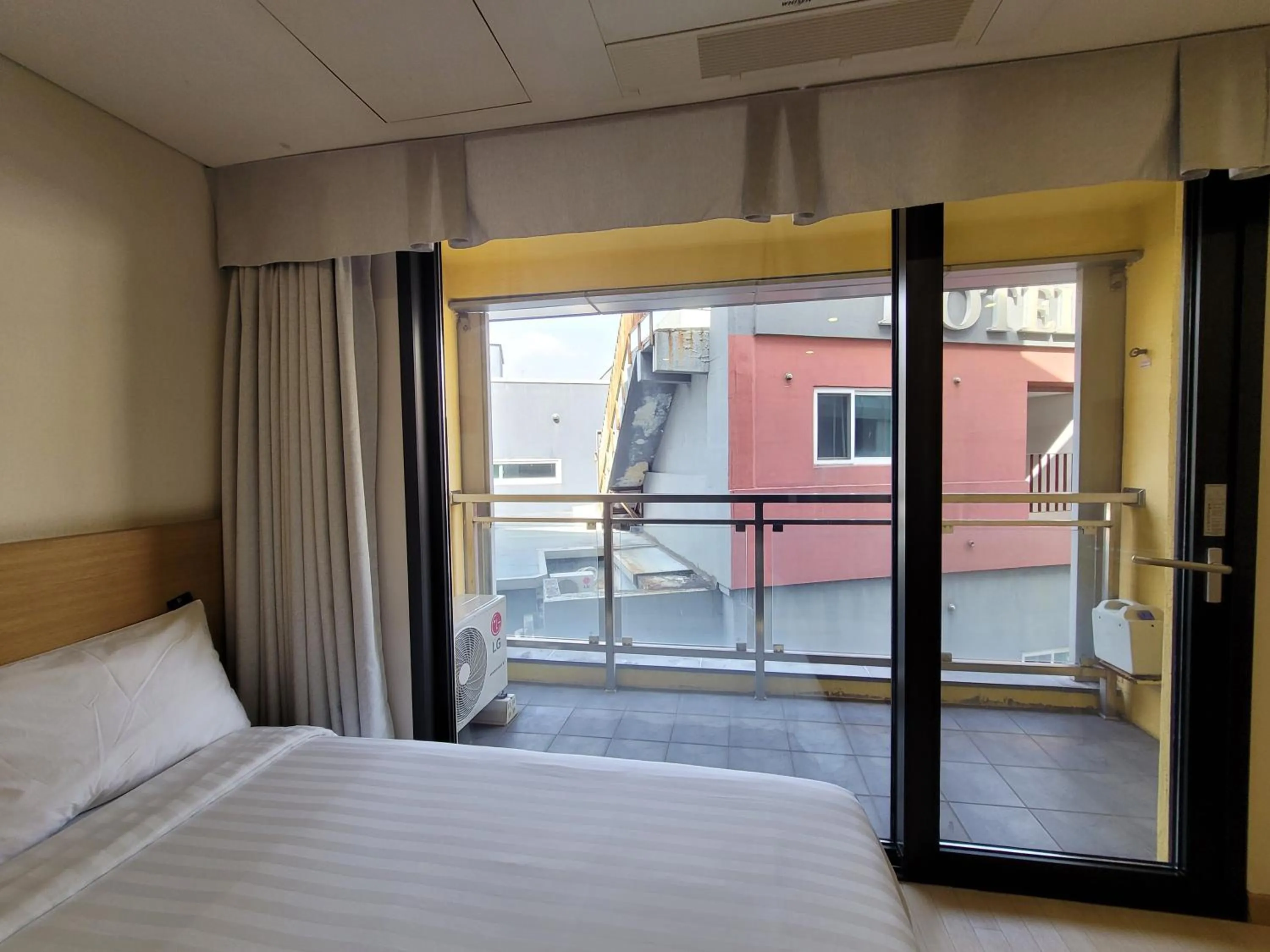 View (from property/room), Bed in BK Hotel Jeju