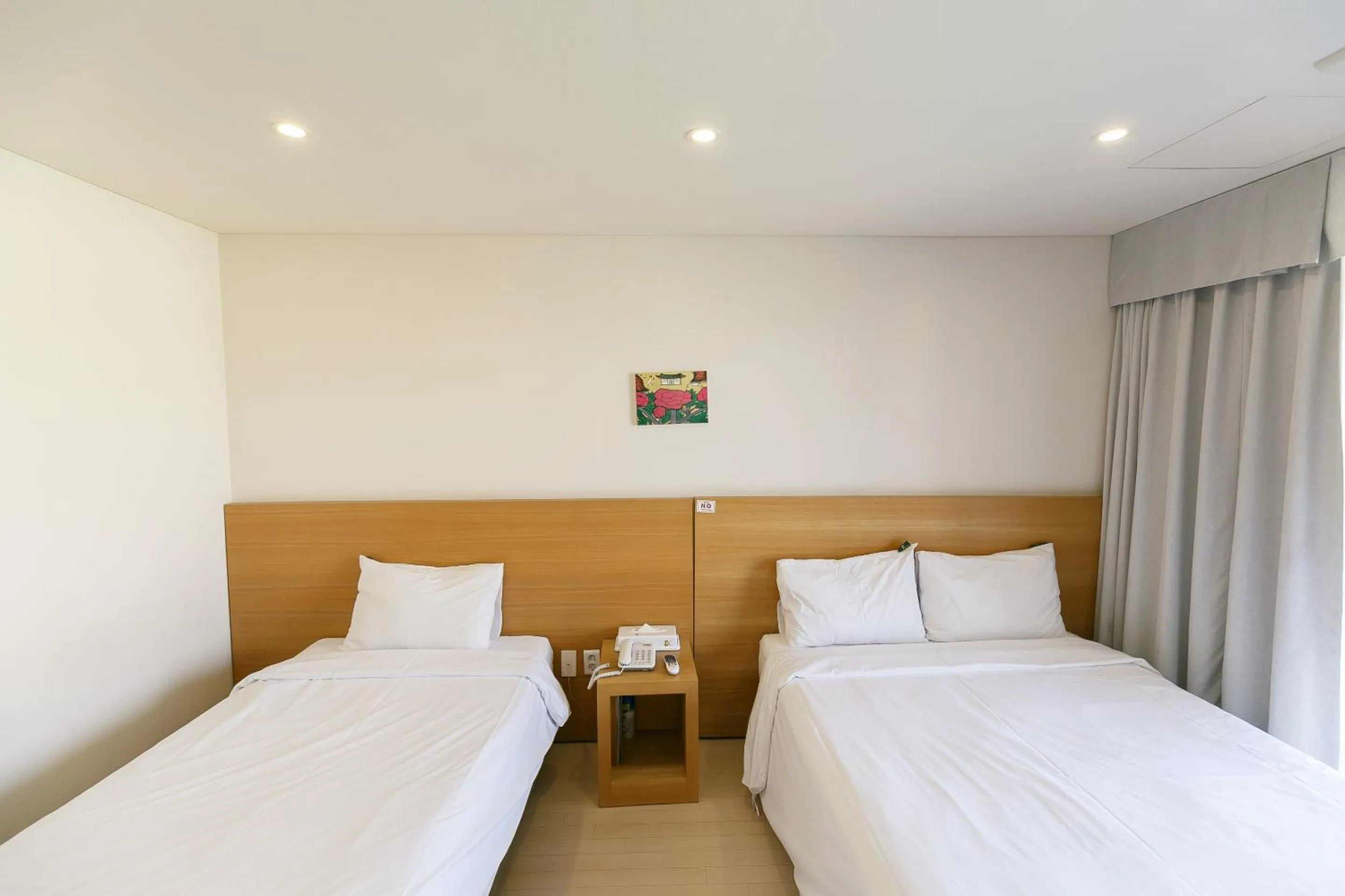 Bed in BK Hotel Jeju