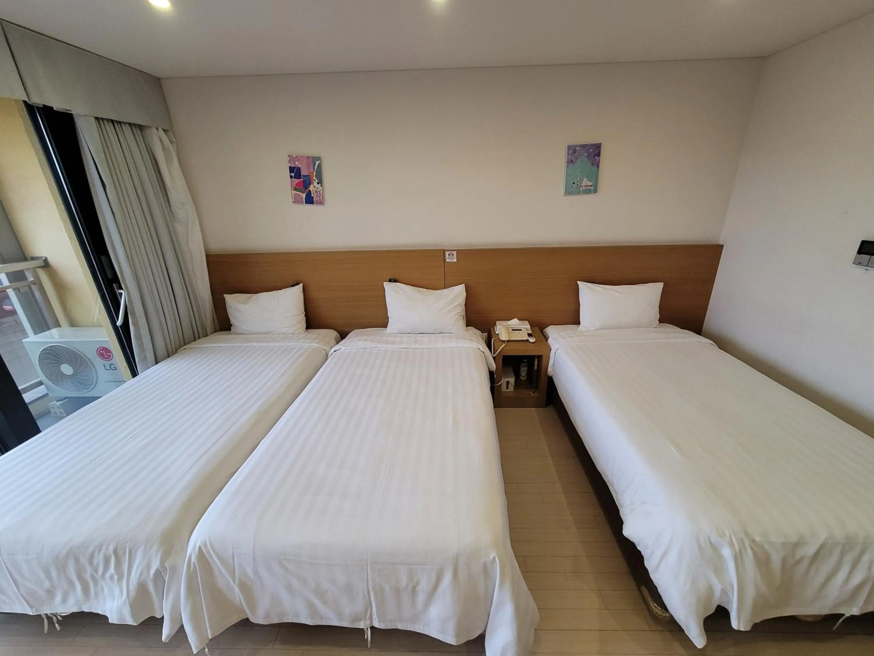 Bed in BK Hotel Jeju