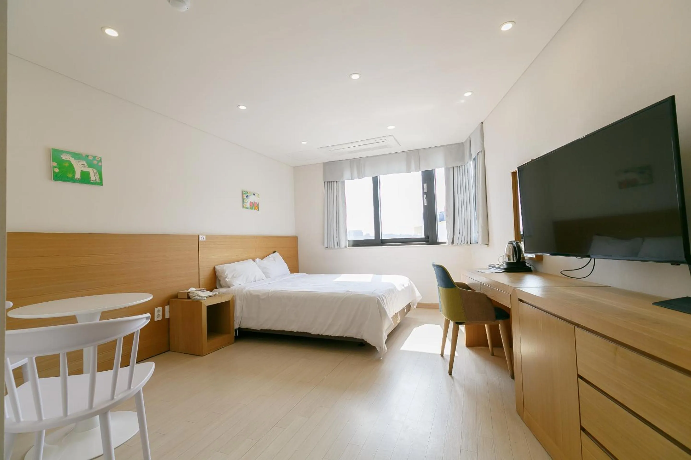 Photo of the whole room, Bed in BK Hotel Jeju