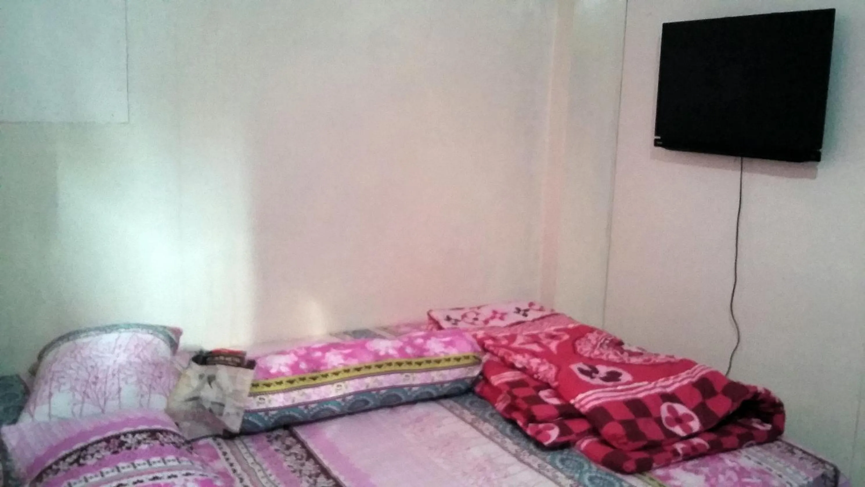Bed in Mayestik Guest House Syariah