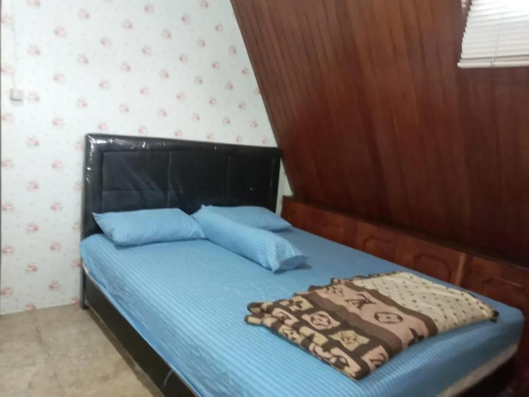 Bed in Mayestik Guest House Syariah