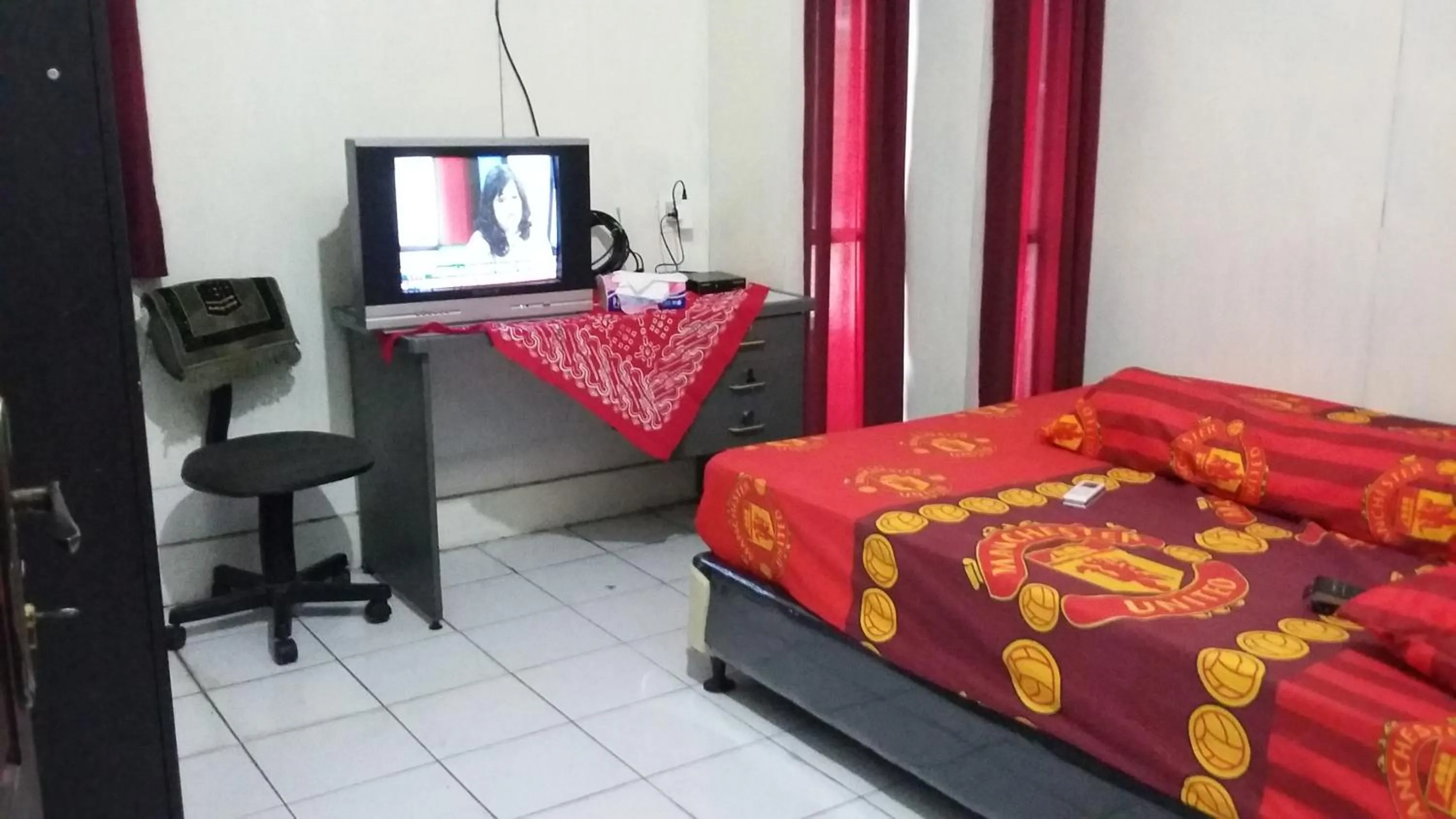 Bed in Mayestik Guest House Syariah