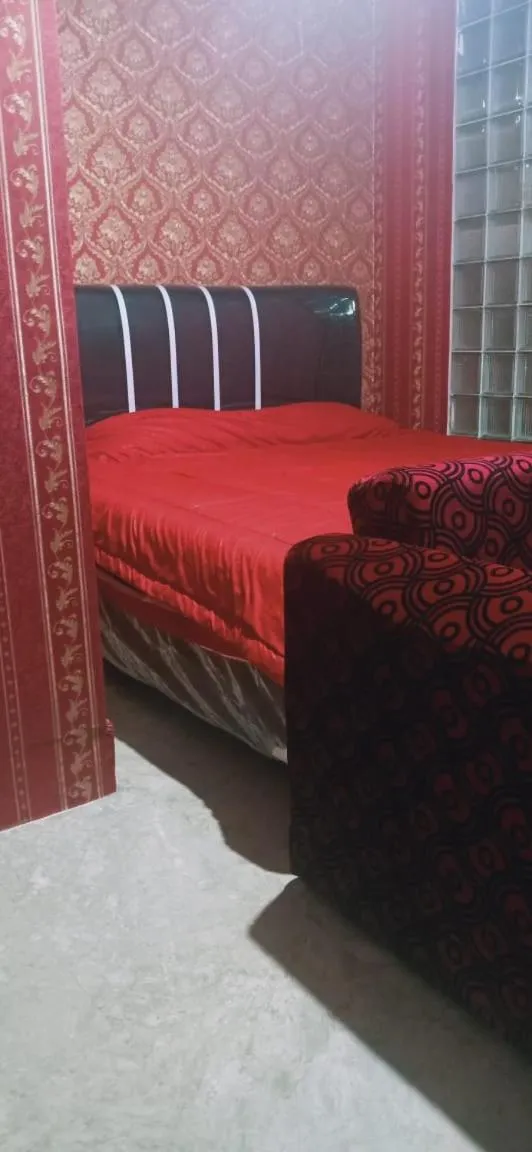 Bed in Mayestik Guest House Syariah