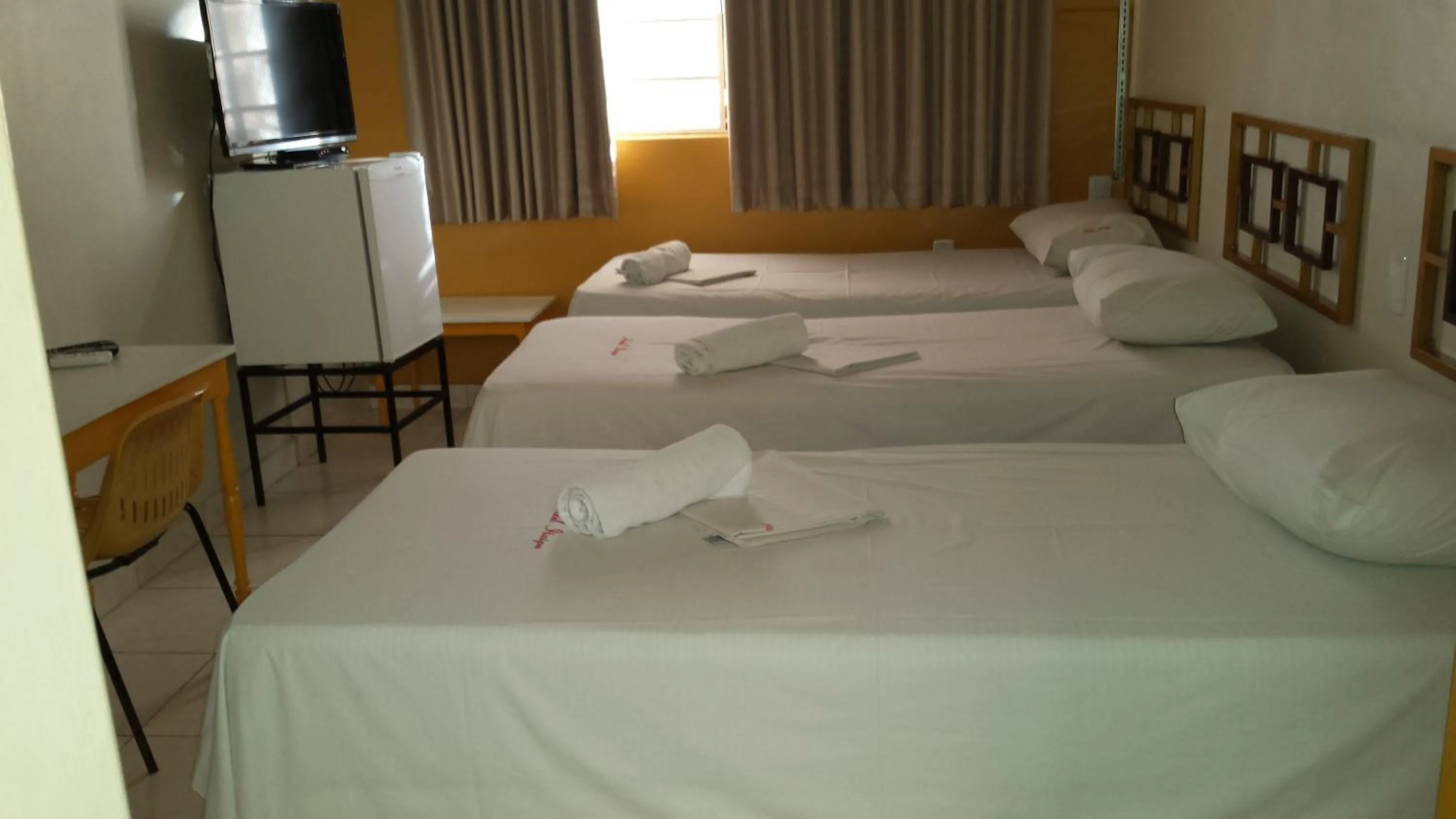 Bed in Hotel Itaipu