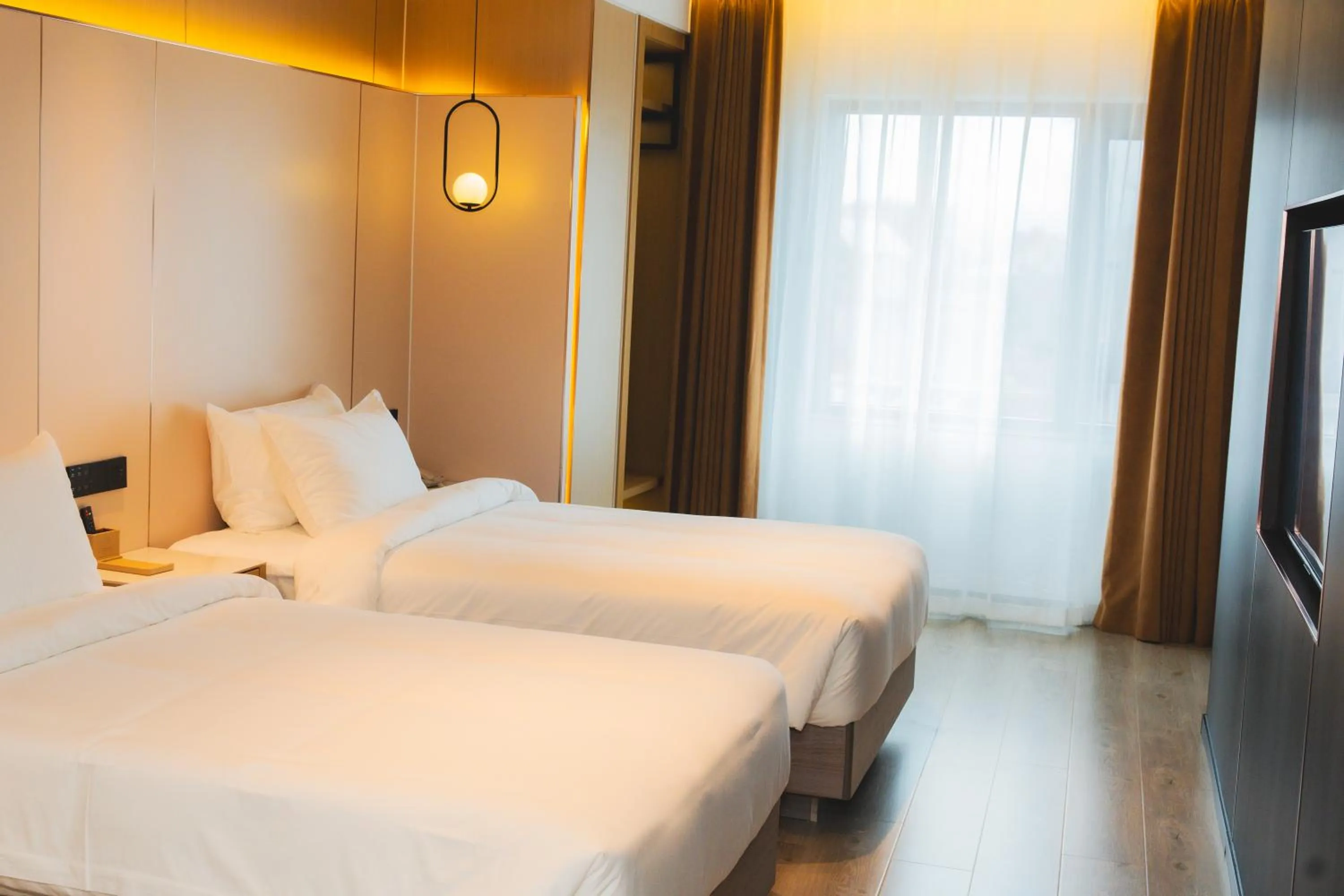 Bed in Jiuding Joy Hotel