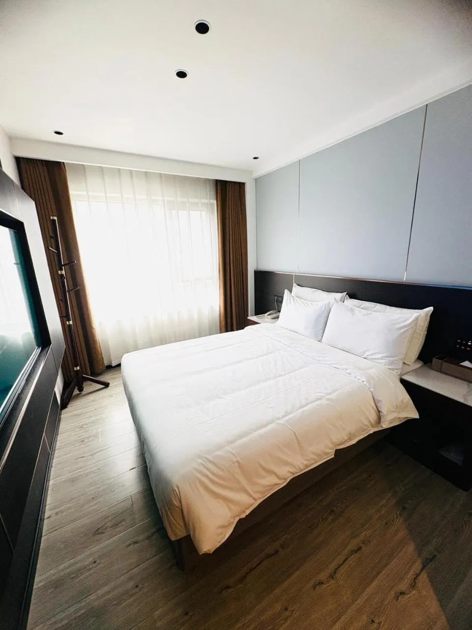 Bed in Jiuding Joy Hotel