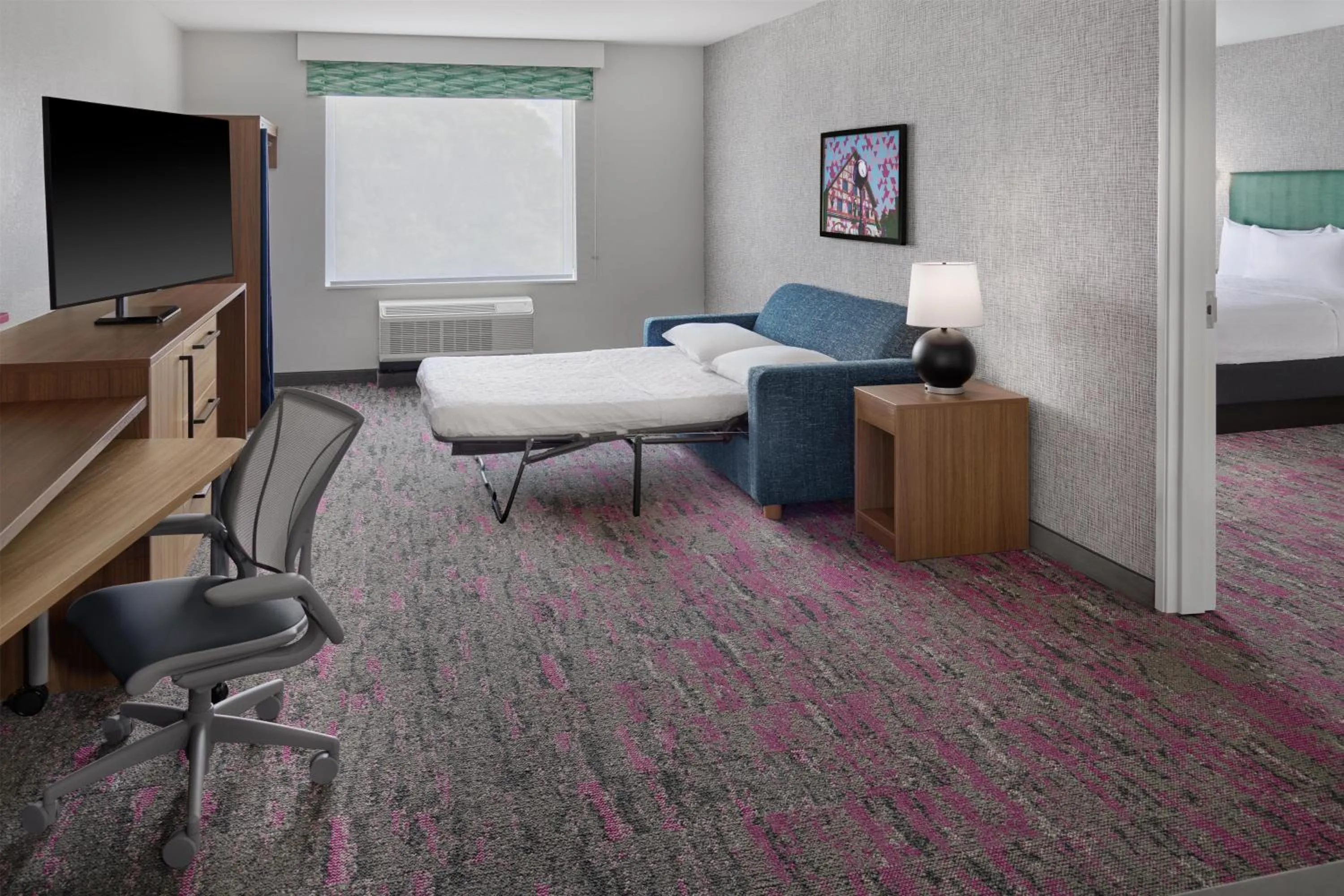 Living room, Bed in Home2 Suites By Hilton Frankenmuth