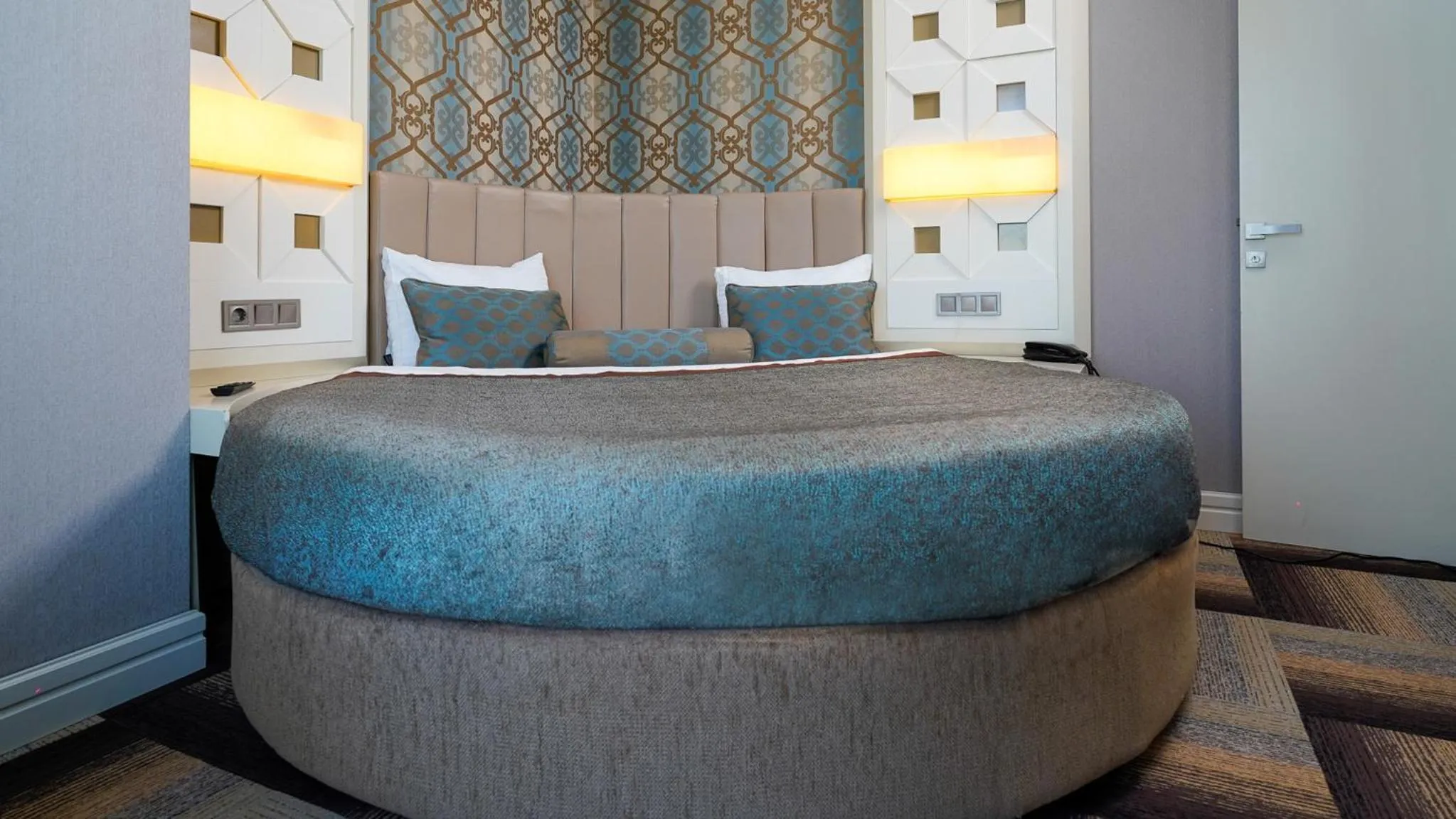 Bed in The Grand Mira Business Hotel