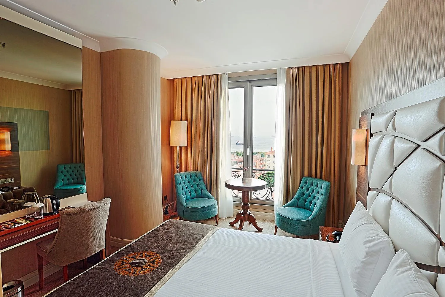 Bed in The Grand Mira Business Hotel