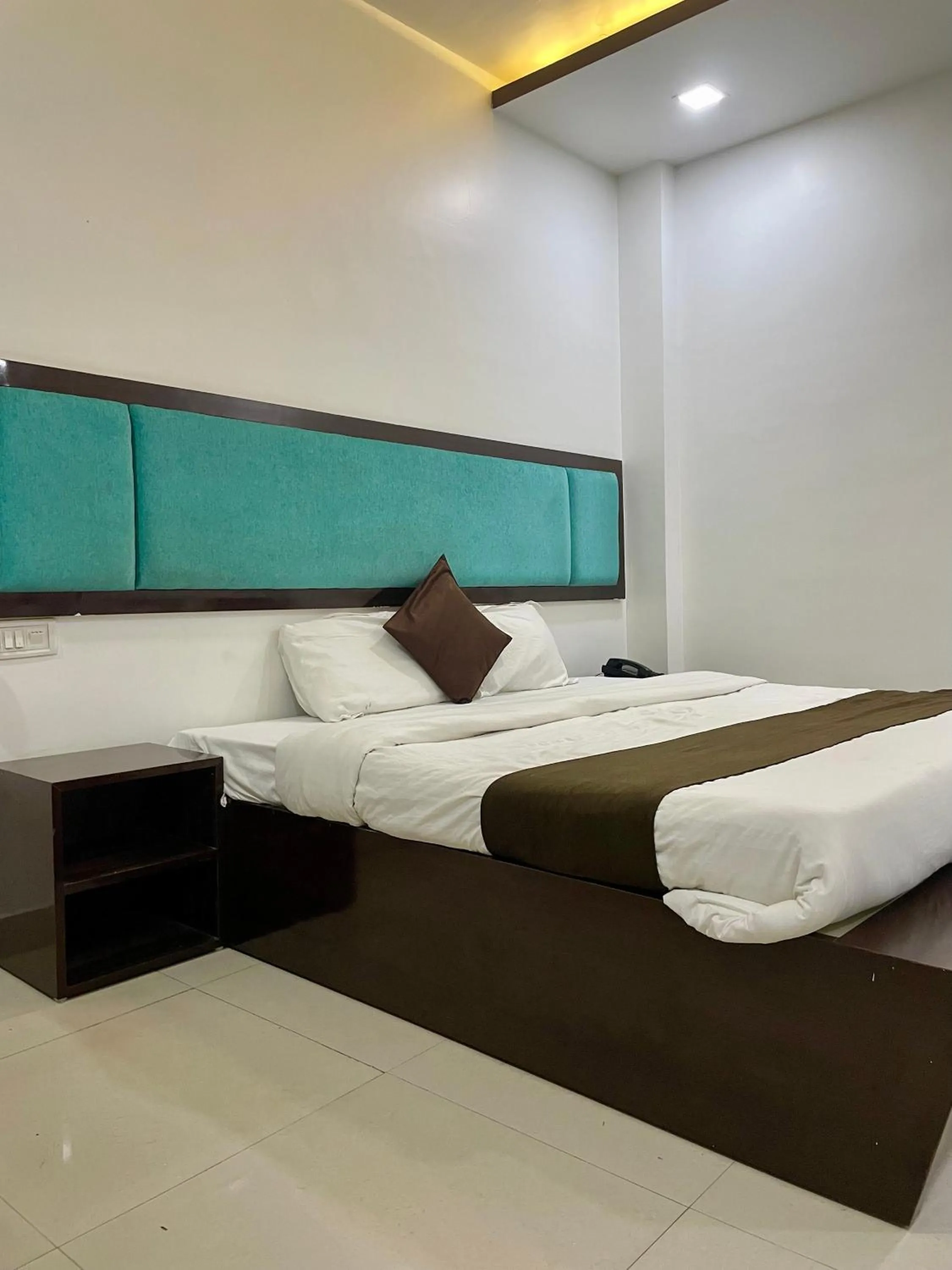 Photo of the whole room, Bed in Hotel Komal Palace Anand Nagar