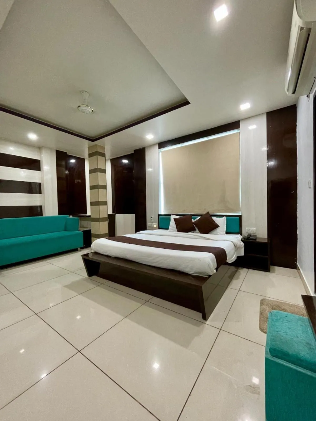 Photo of the whole room, Bed in Hotel Komal Palace Anand Nagar