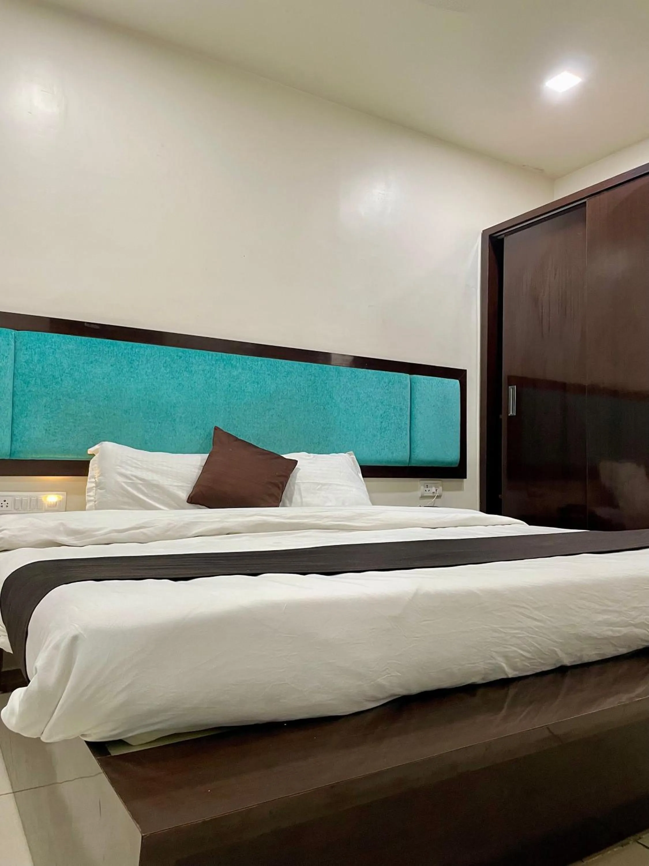 Photo of the whole room, Bed in Hotel Komal Palace Anand Nagar