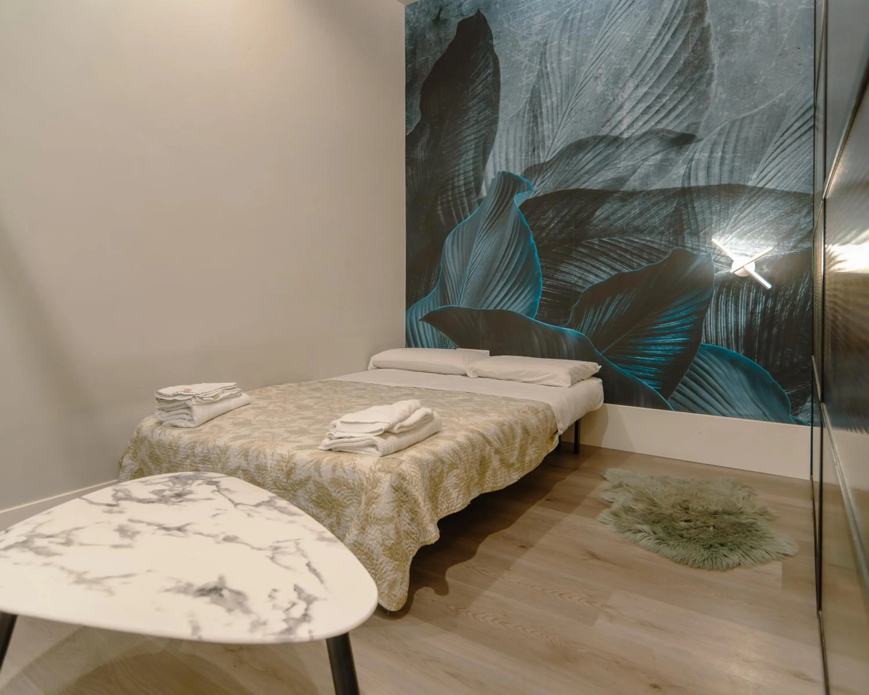 Bed in VESUVIANUS Rooms and More